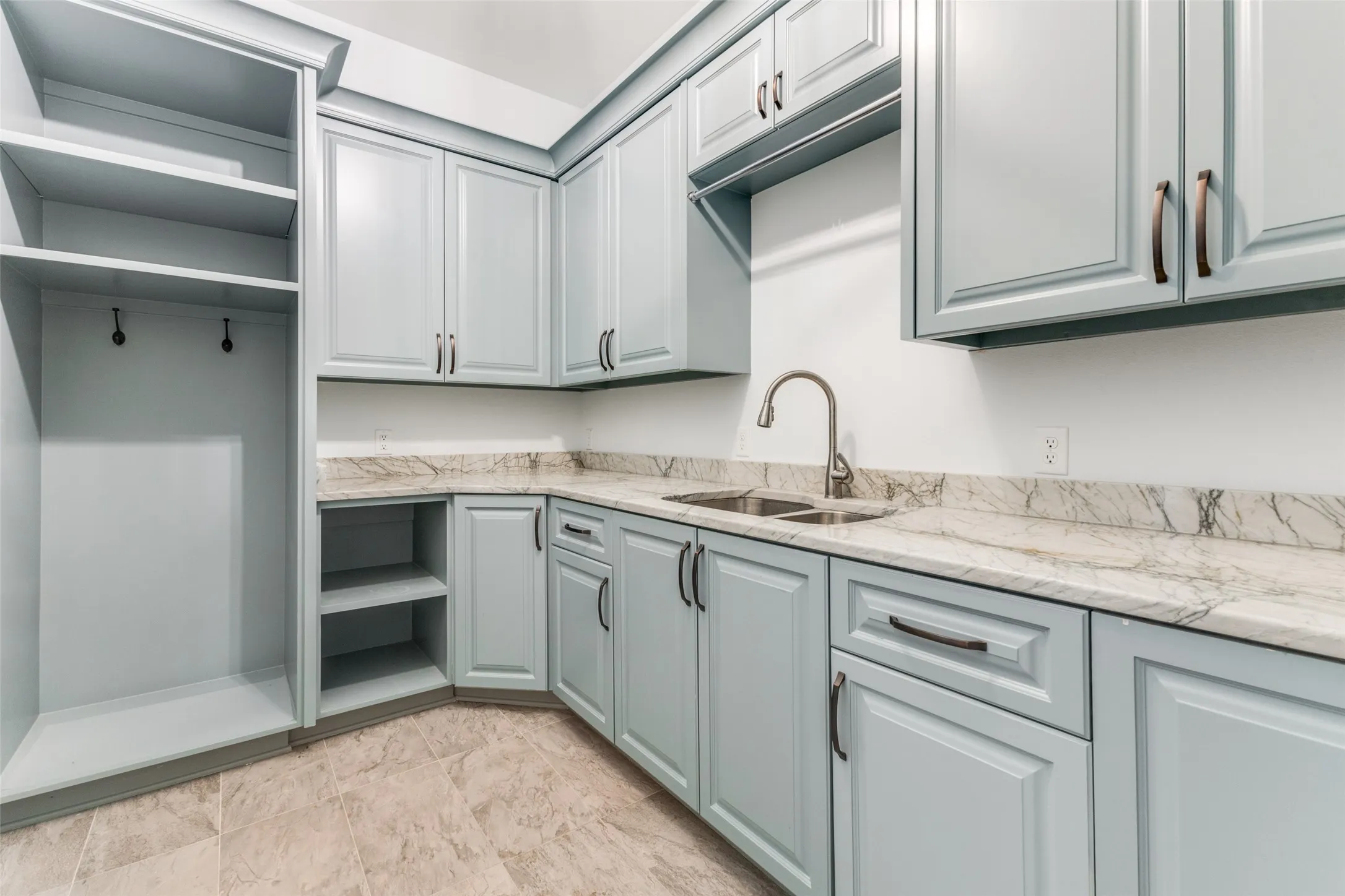 Laundry room is incredible with gorgeous built in cabinets, sink and counter.  Ready for full size washer and gas OR electric dryer on opposite wall.