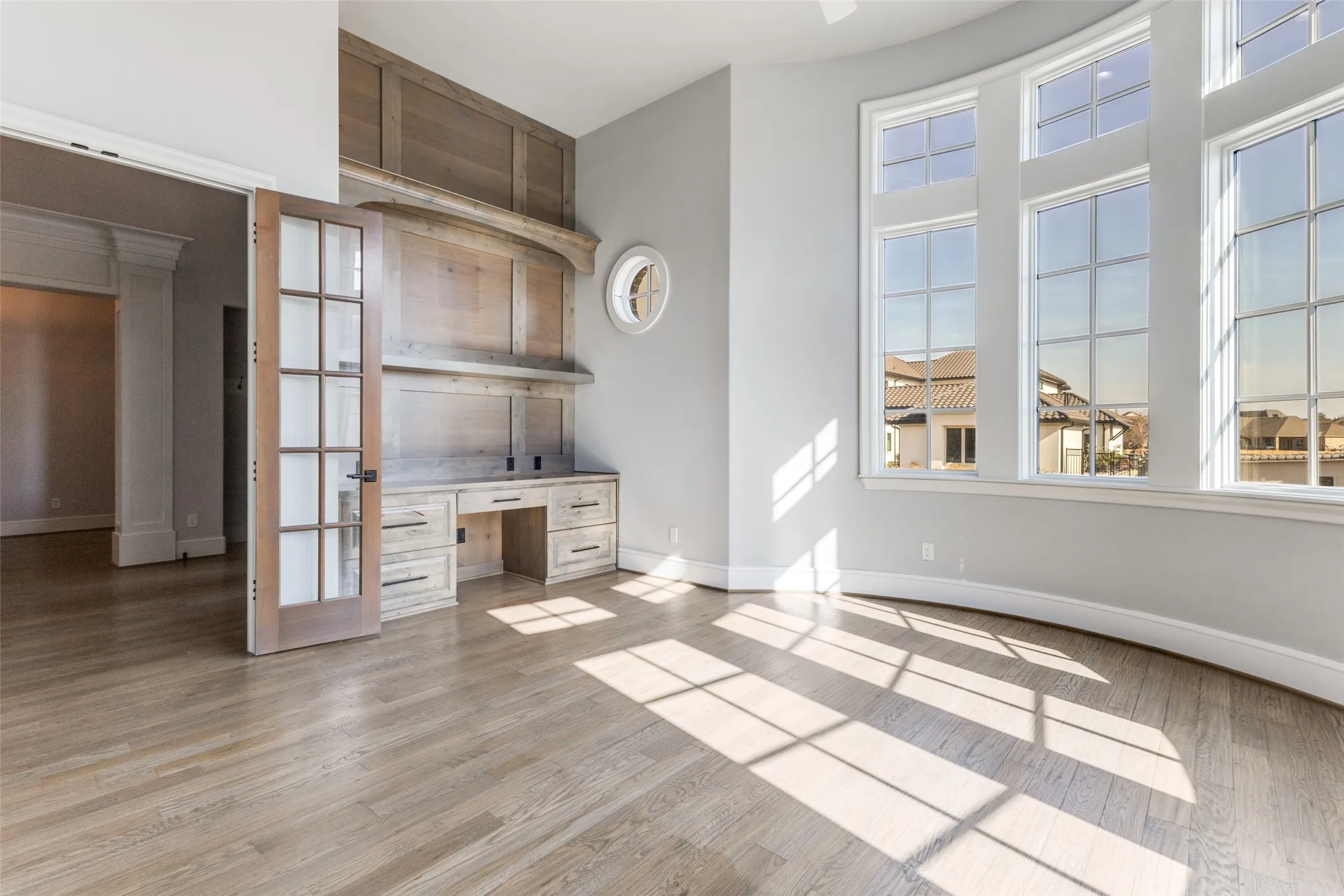At front of home, you will find an executive study with built in and great architecture including a curved wall.