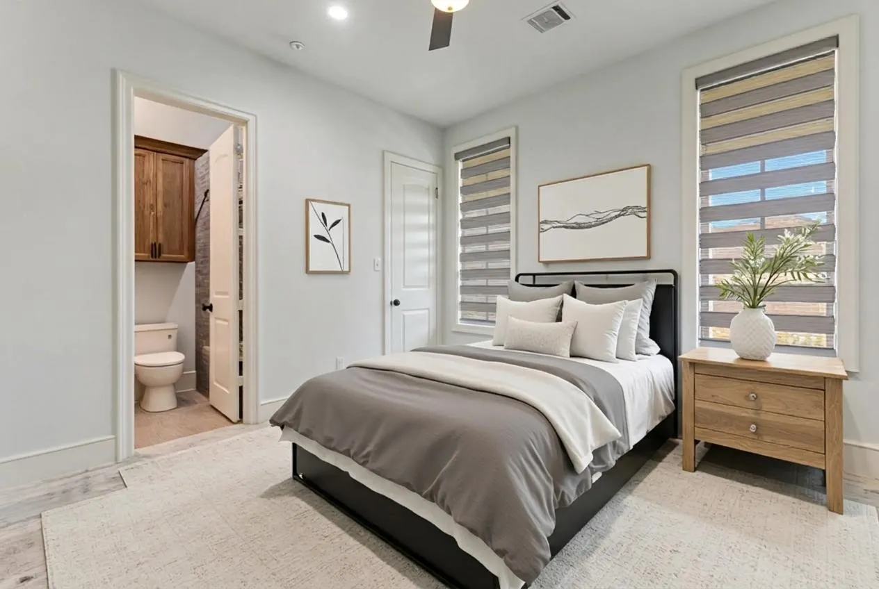 One of the five bedrooms in home with direct access to bath.  VIRTUALLY STAGED