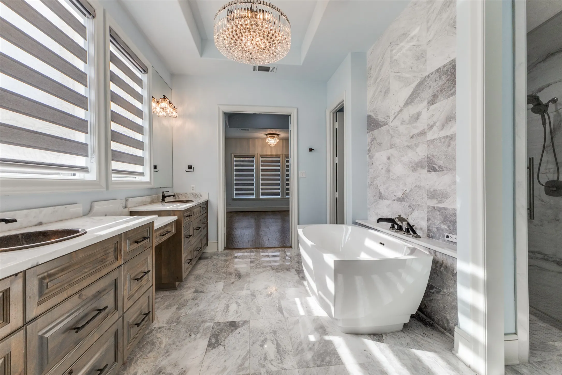 Walk in shower located behind free standing tub and equipped with Mr. Steam technology.  Yet another high end finish in this home that has it all!