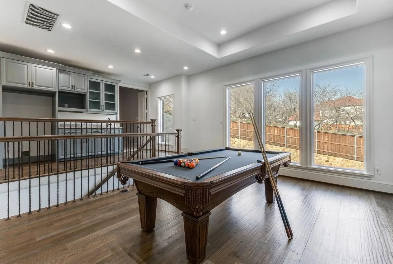 Upstairs Game Room with wet bar and room for a full sized refrigerator.  VIRTUALLY STAGED