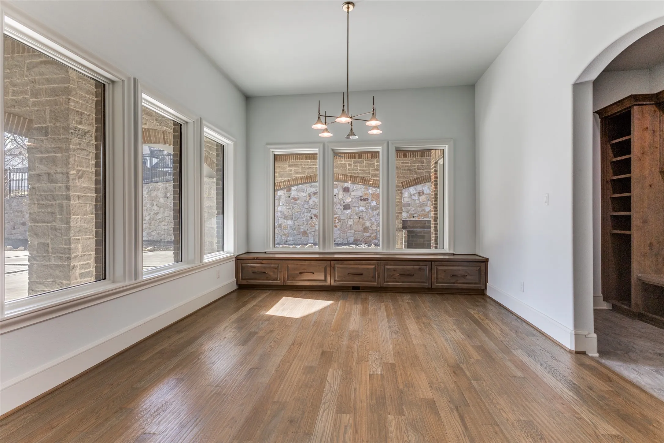 Yet another space with built ins in dining area and a peek into the incredible mud room leading to pool bath.