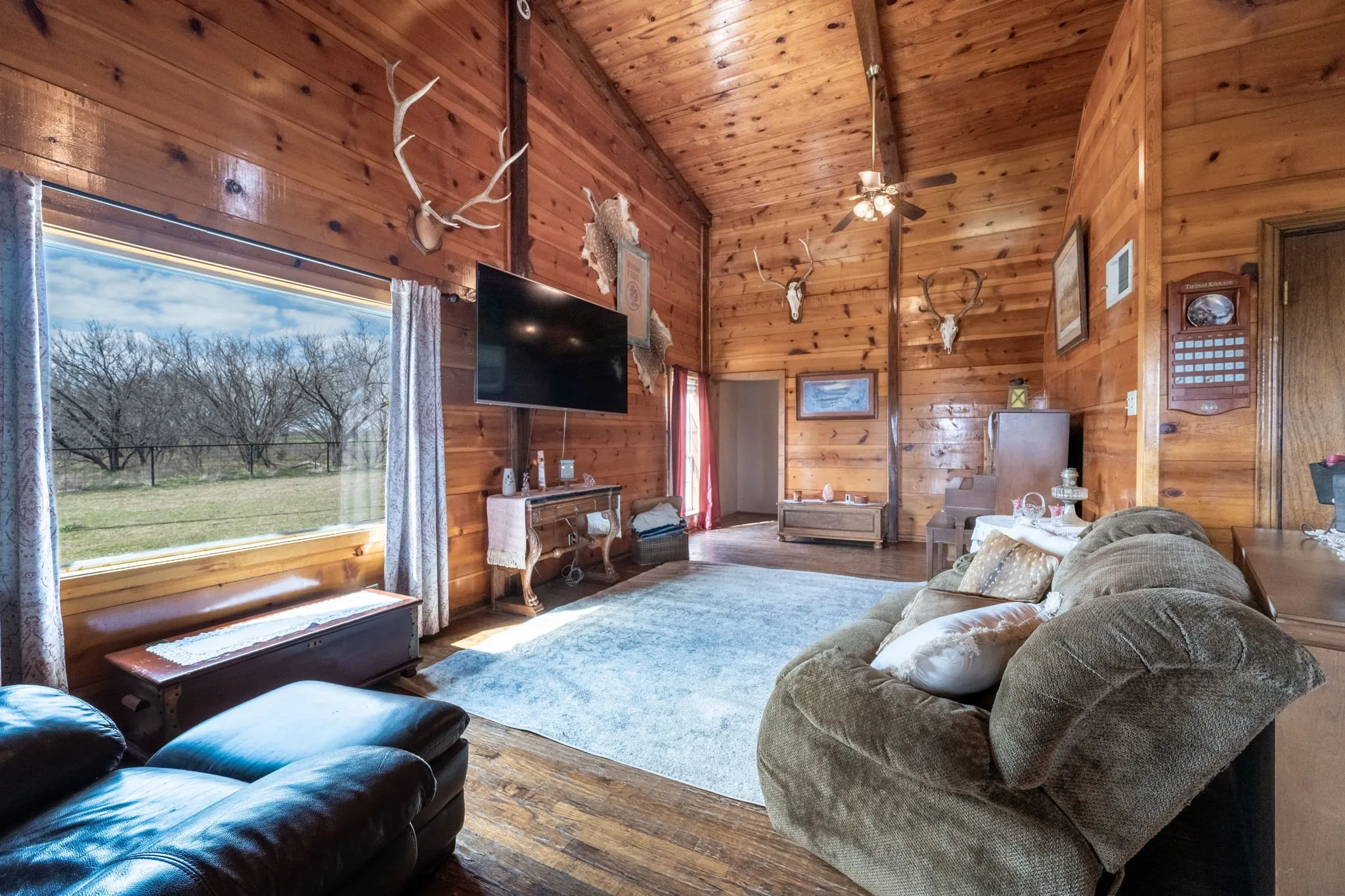 Family Room- LOOK AT THOSE CEILINGS! Pine clad walls and ceiling!