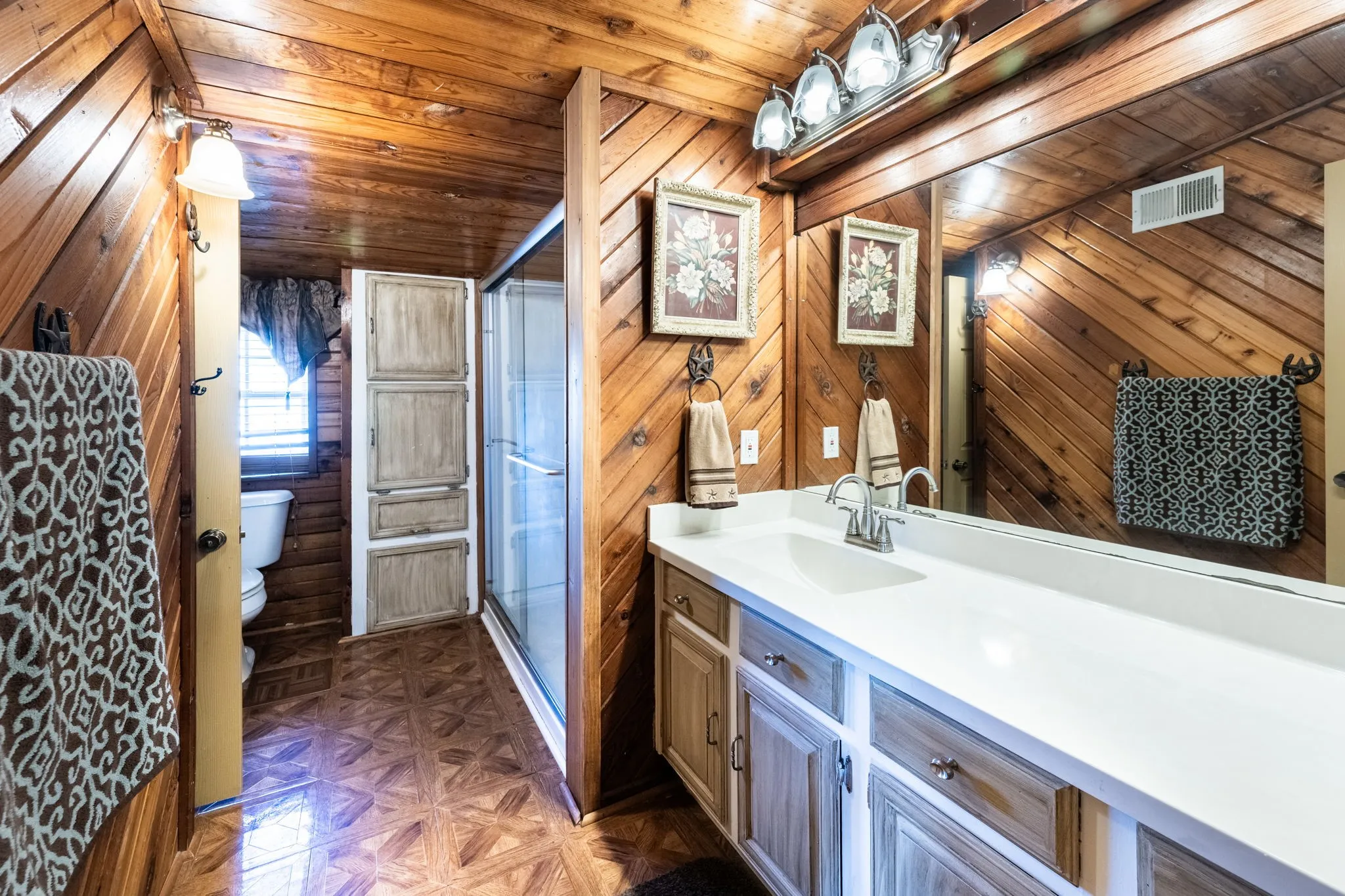 Upstairs bathroom with large walk in shower.