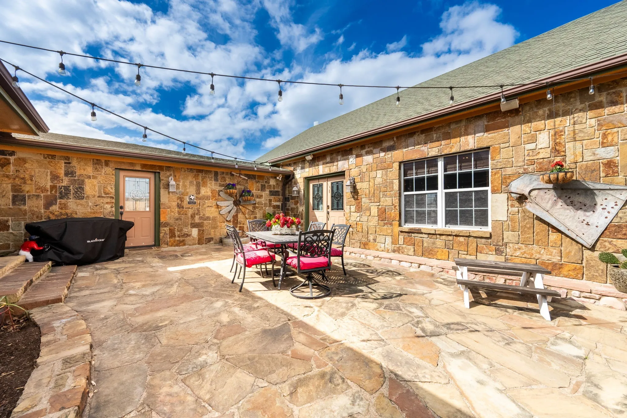 Flagstone entertaining area that leads into the enormous 28 x 38 enterainment lodge.