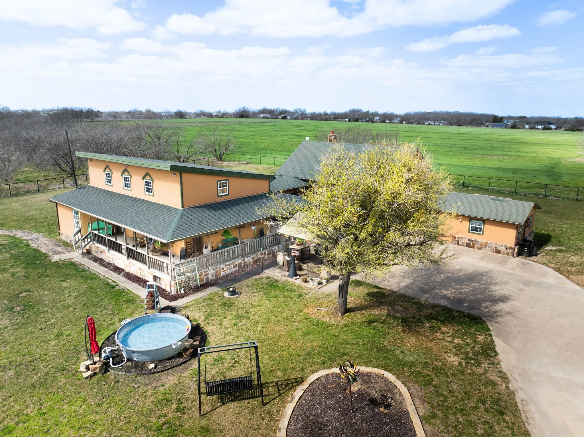 Cowboy pool, wrap around porch, outdoor and indoor entertaining spaces