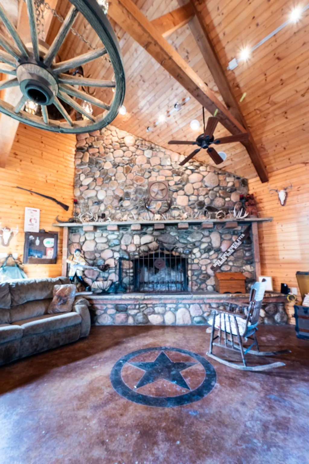 Floor to ceiling stone fireplace.