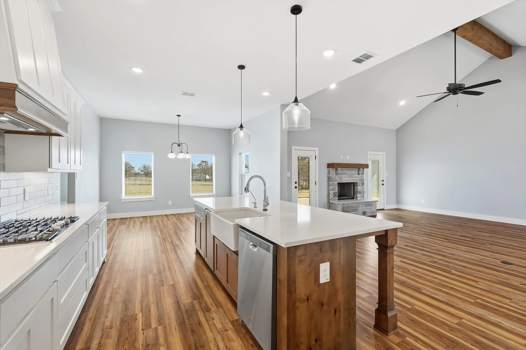 Open sightlines, effortless flow. The island sink faces the living room and fireplace, making it easy to cook, visit, and keep everyone connected.