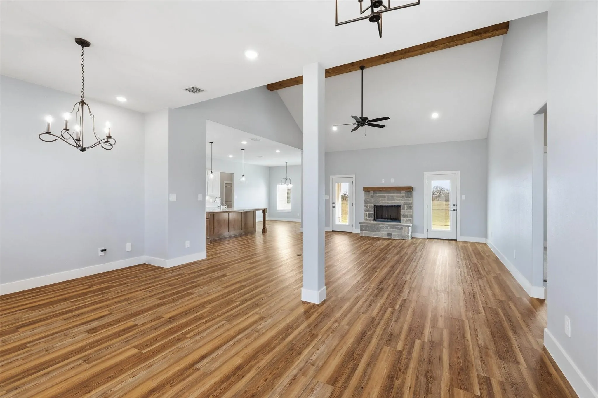 Open-concept done right. A spacious layout connects living, dining, and kitchen—made for entertaining—with high ceilings, recessed lighting, and views that keep it light and airy.