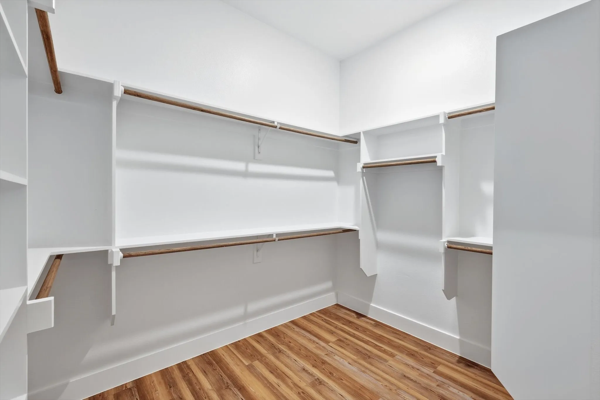 Big walk-in primary closet. Plenty of hanging space and built-ins for easy organization—room for everything, not just the basics.