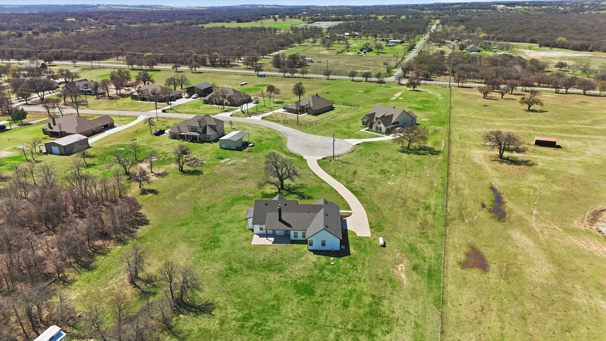 Enjoy the best of peaceful country living with a spacious lot, scenic surroundings, and a private setting that still feels connected to a desirable neighborhood community.
