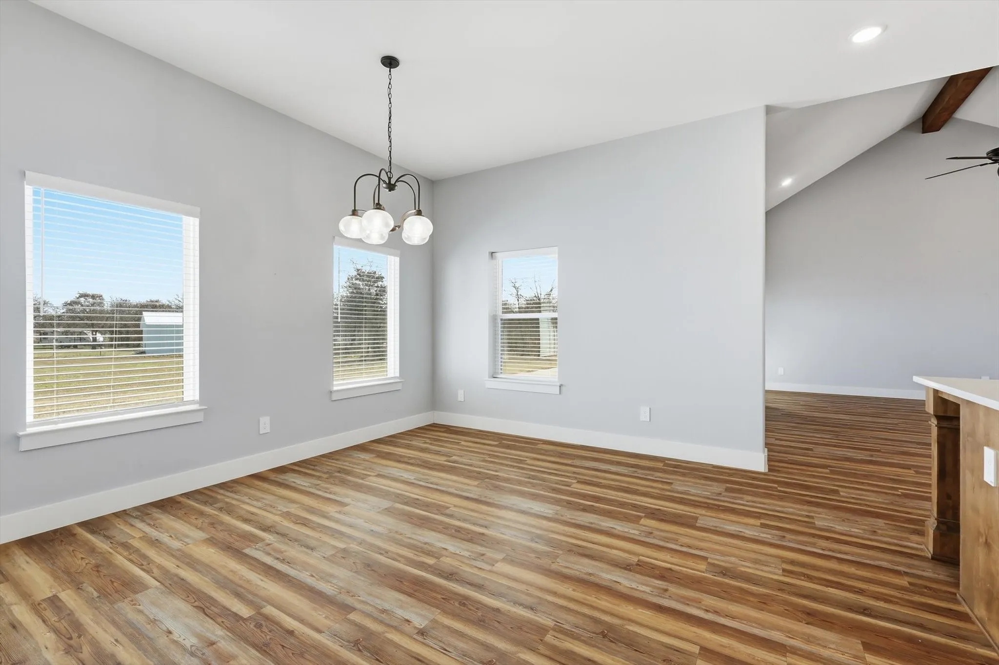 Another angle of the breakfast nook showing the open flow into the main living area—bright, airy, and ideal for entertaining.
