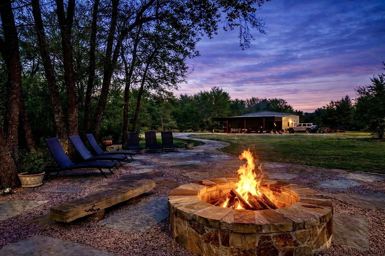 flagstone sitting area with custom fire pit