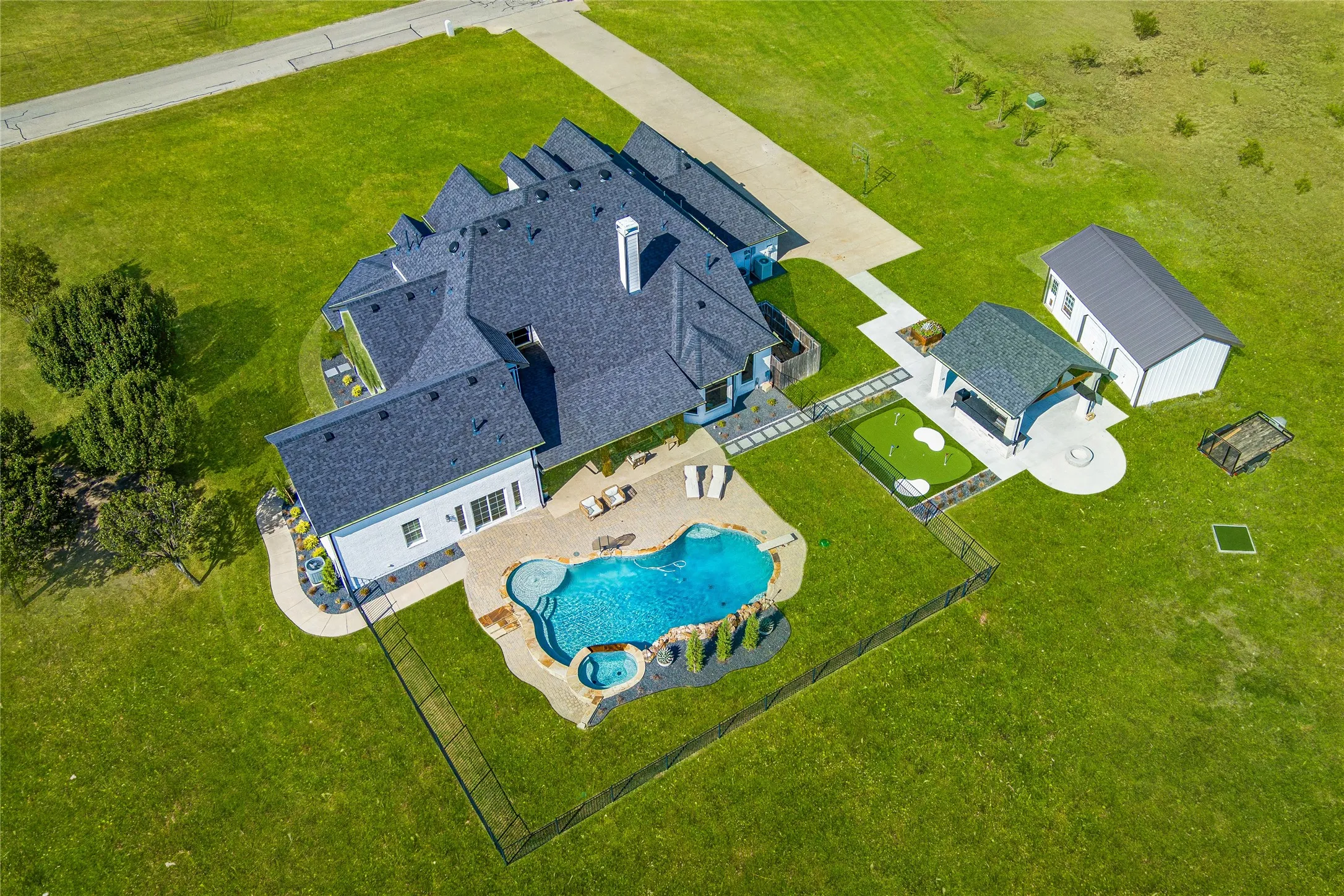 View of subject property with a pool