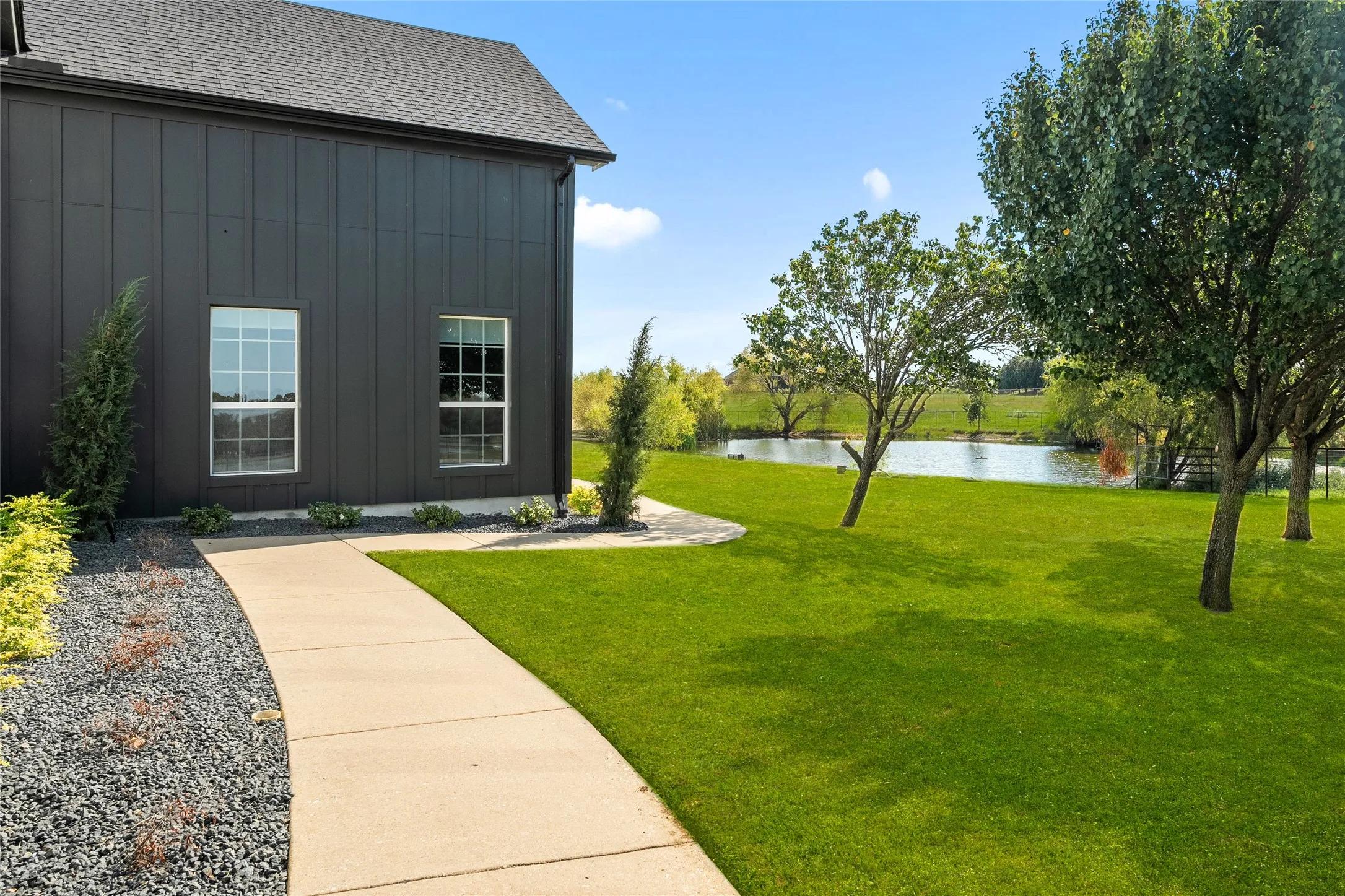 View of grassy yard featuring a water view
