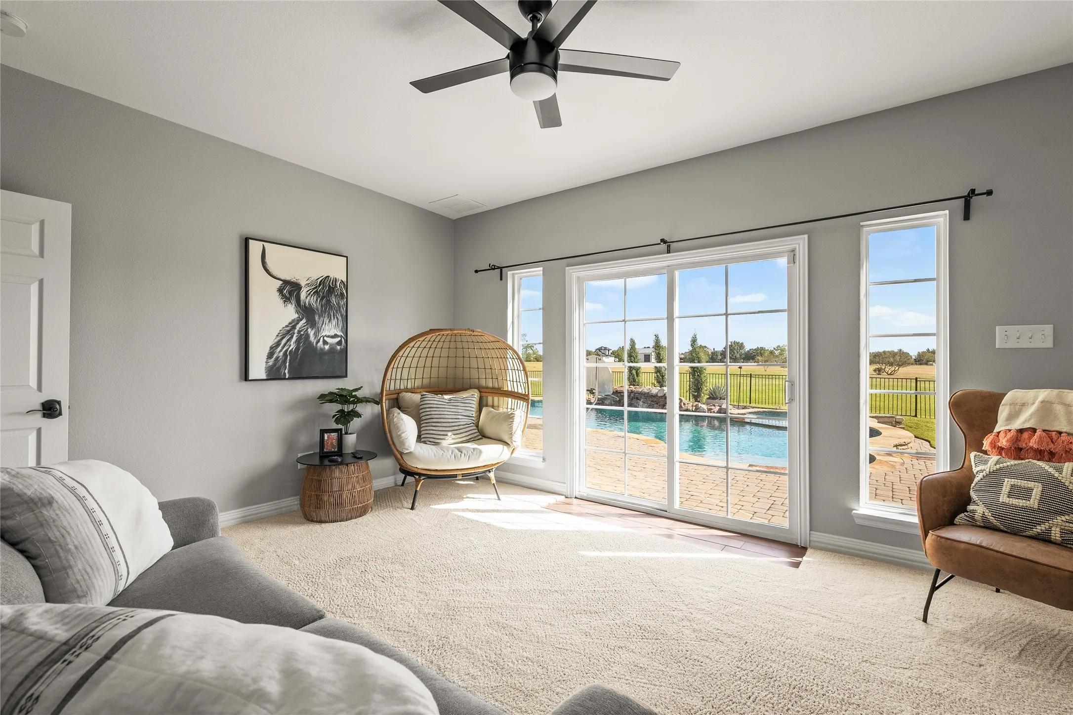 Sitting are in MIL Suite or 2nd primary, with a ceiling fan and carpet