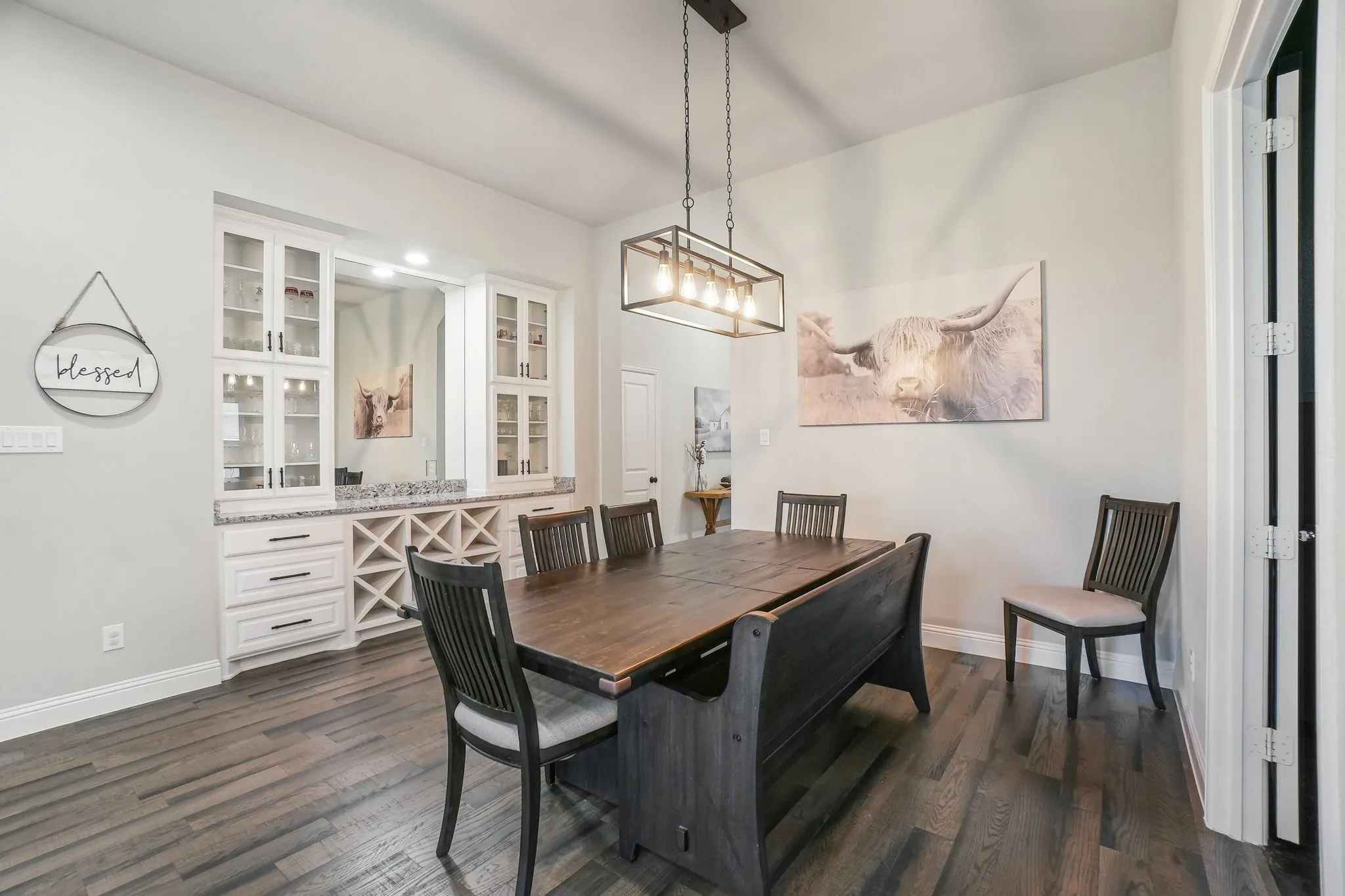 Dining area with dark wood-style floors