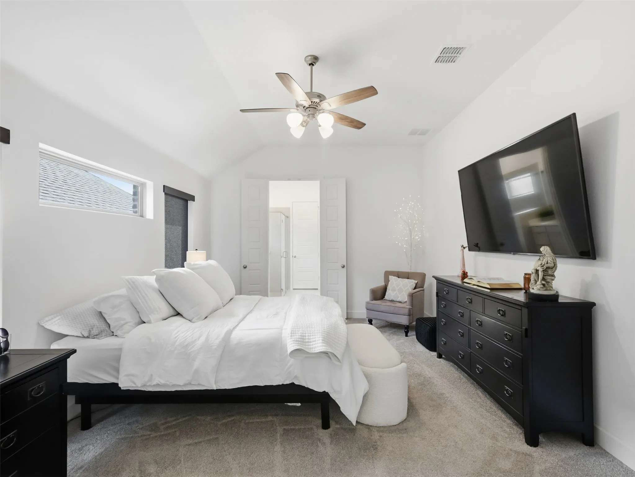 The spacious primary provides vaulted ceilings, beautiful sunlight and ample space to relax!