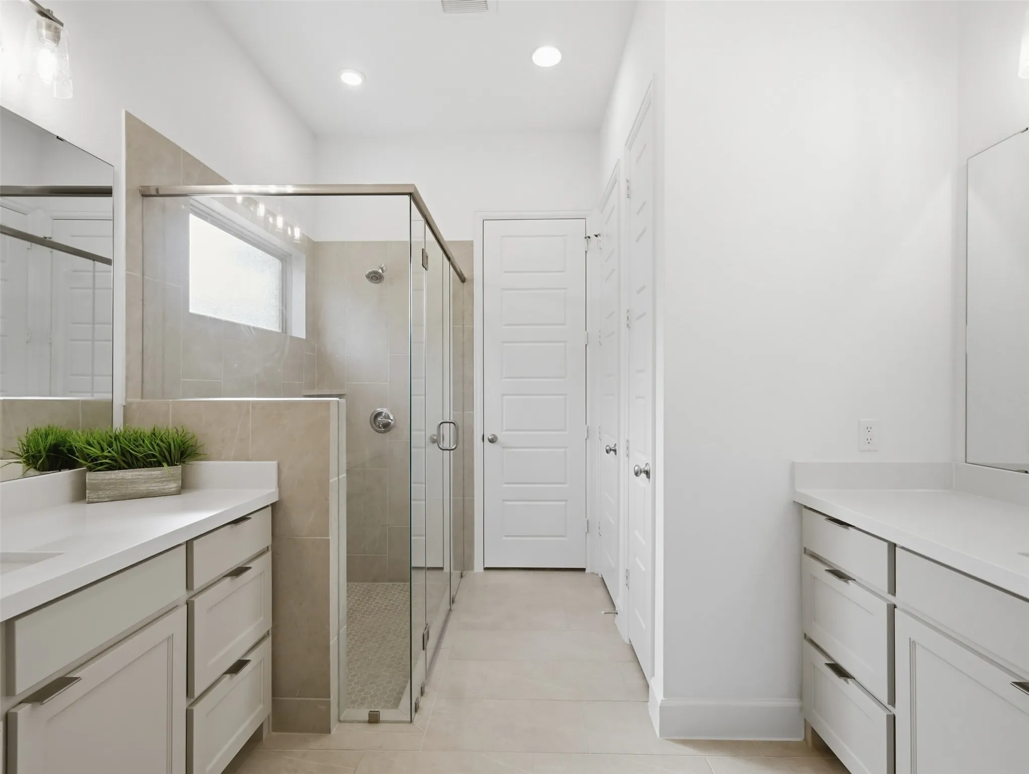 Double vanities and an oversized shower make for a great space to start your day!