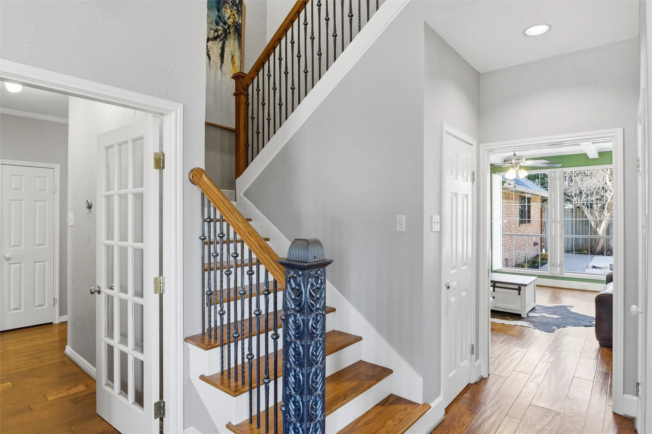 Staircase with hardwood / wood-style floors, recessed lighting, and ceiling fan