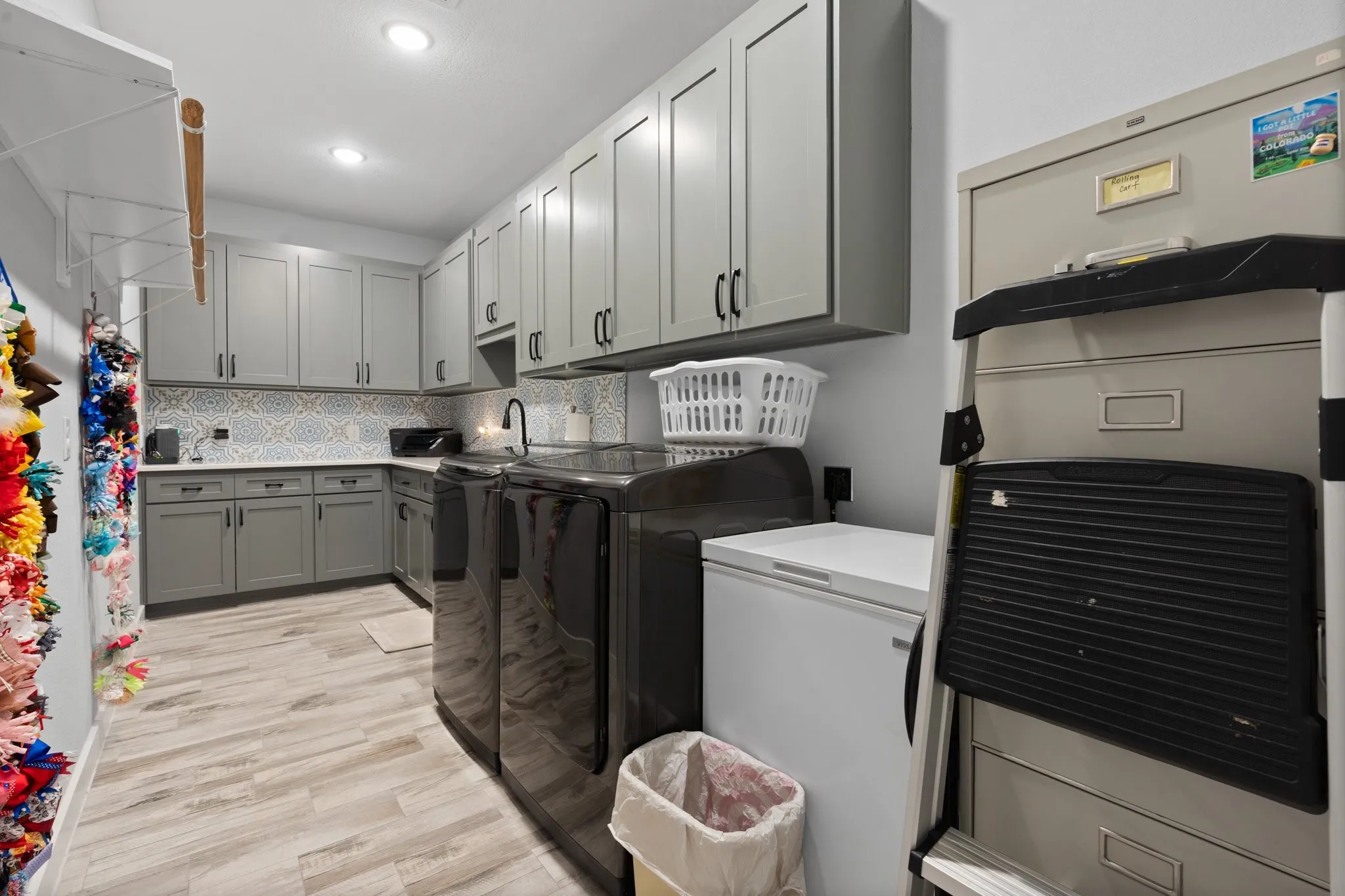 Laundry room with plenty of cabinets