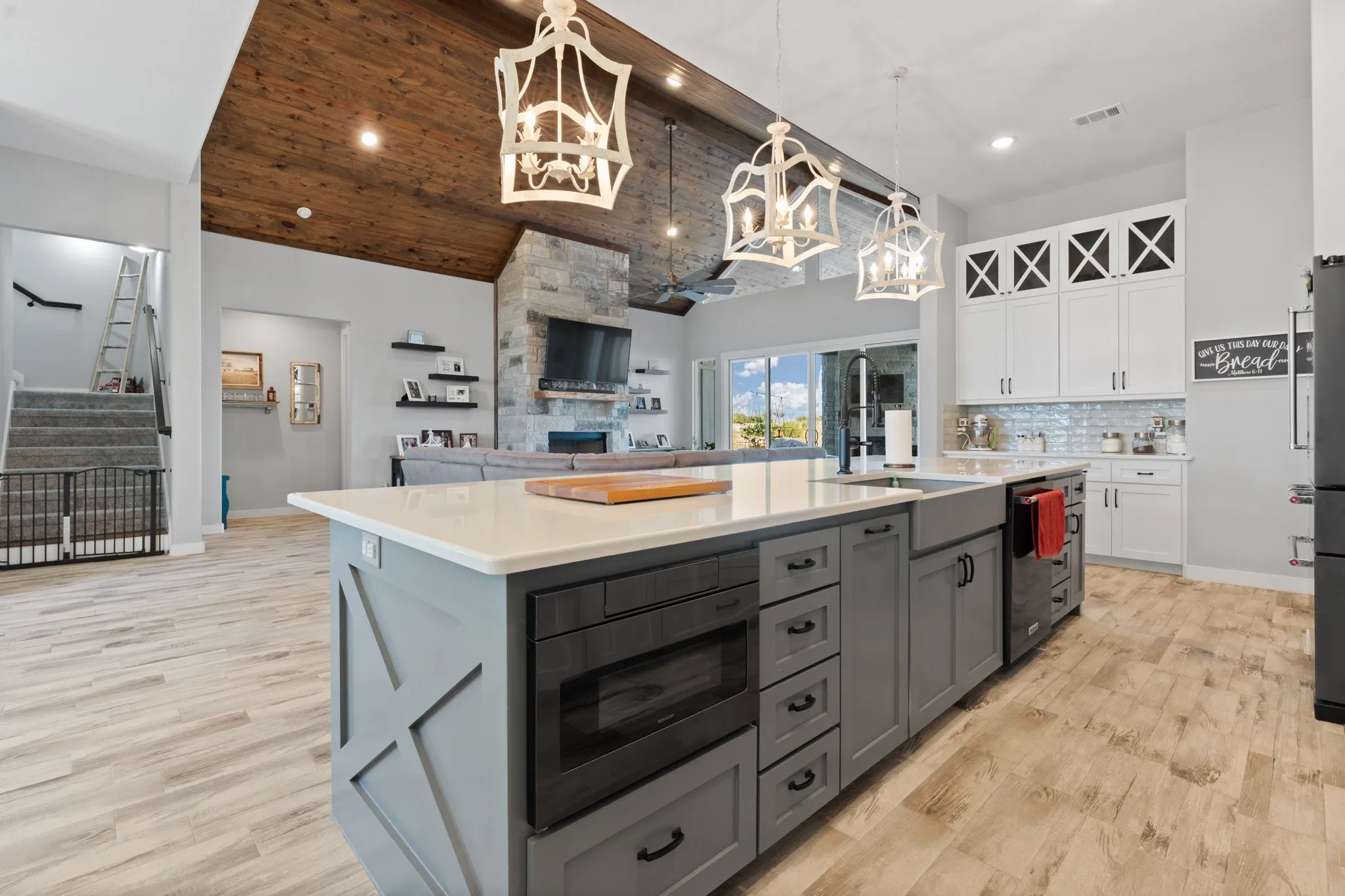 Kitchen island with built in microwave and trash can