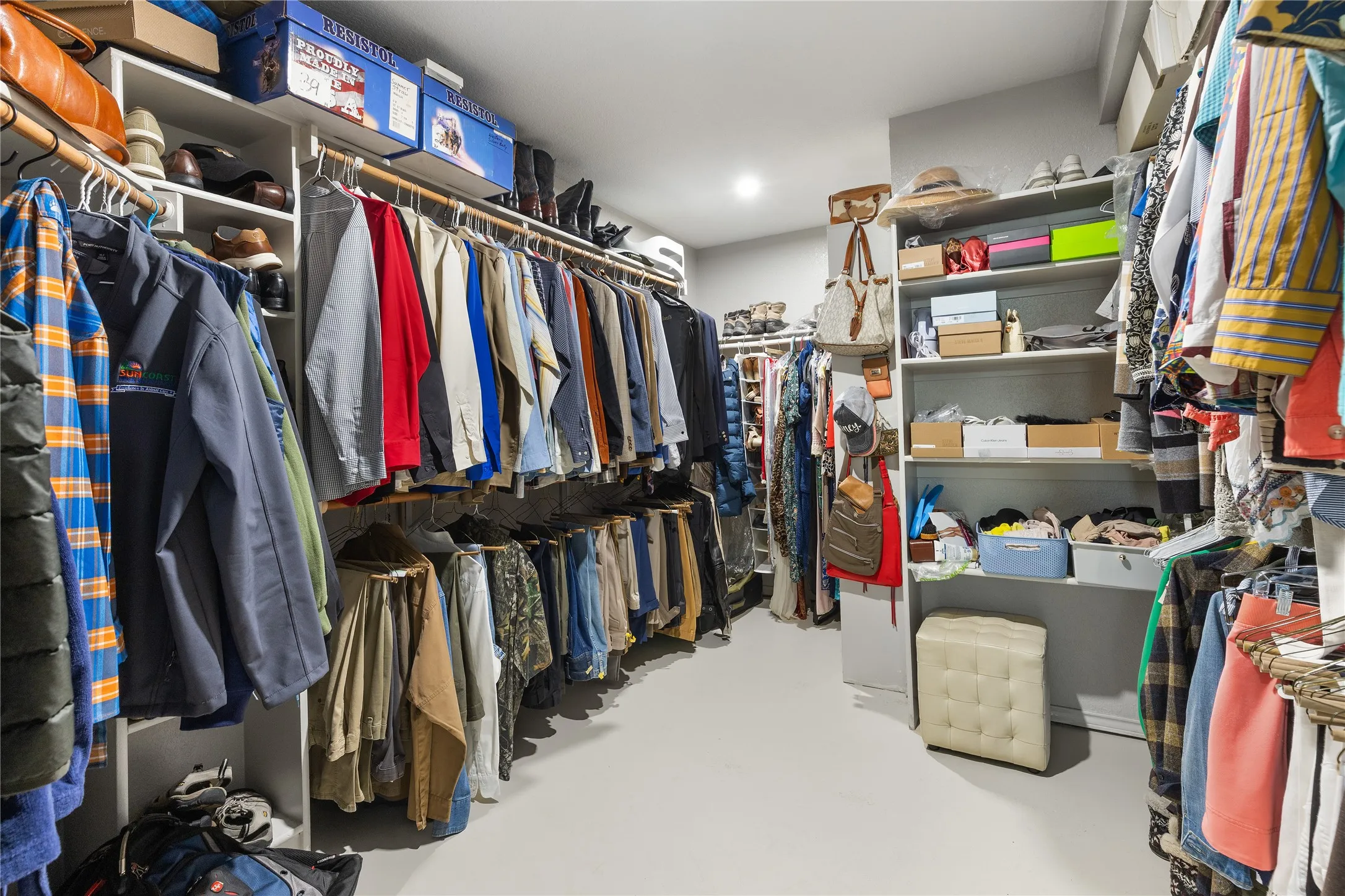 View of primary bedroom walk in closet