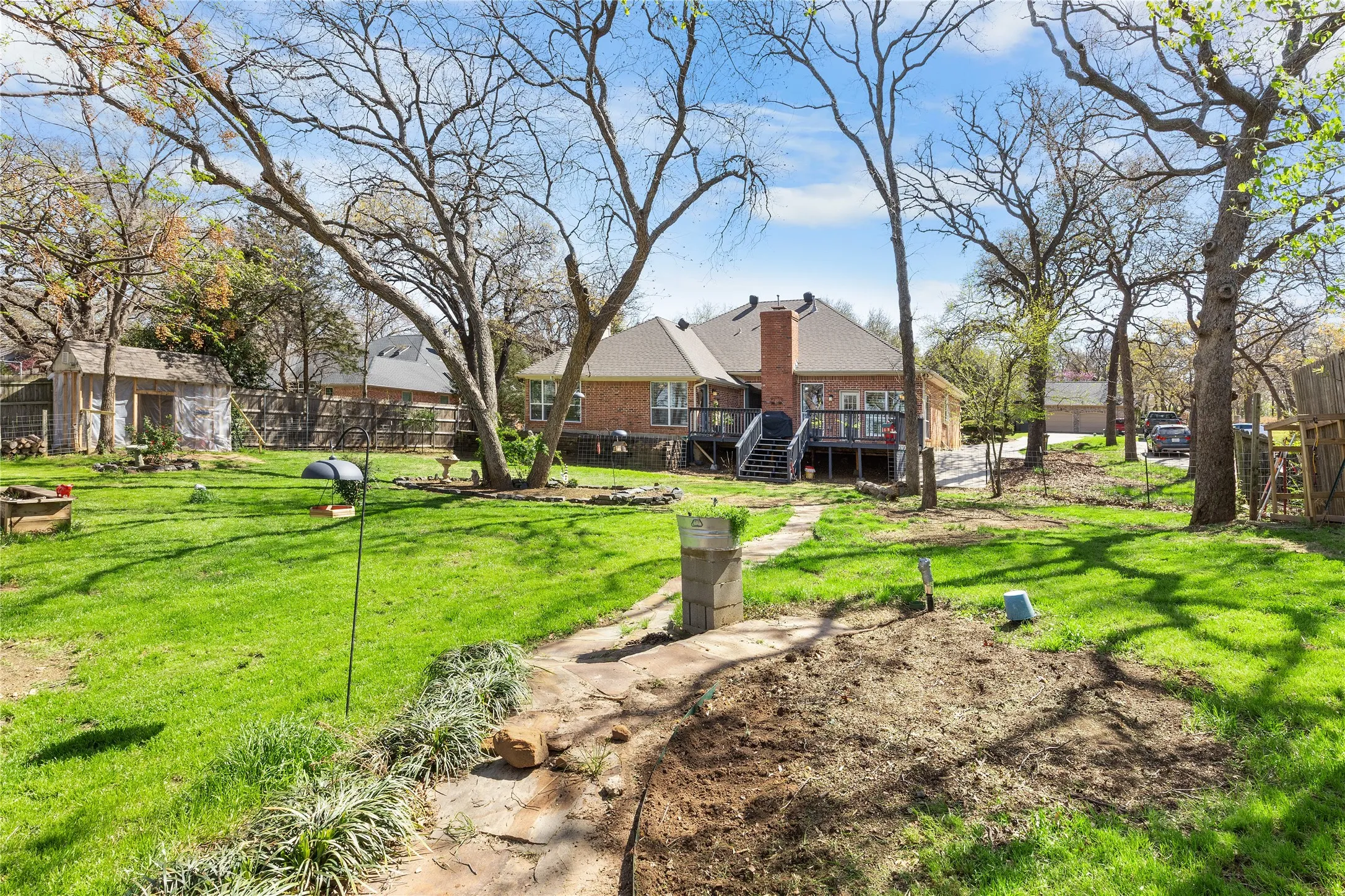 Fenced yard featuring a wooden deck