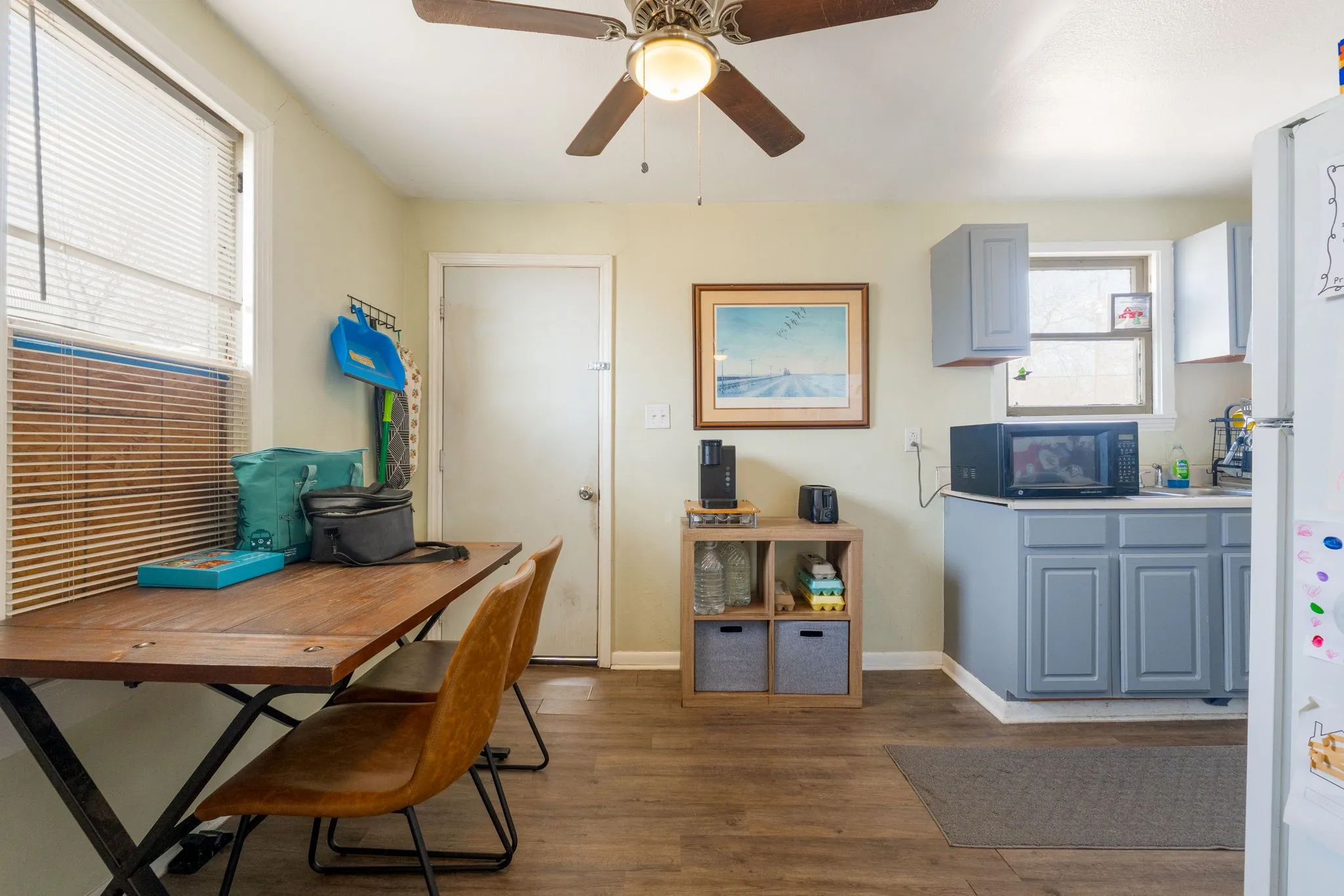 Office featuring dark wood finished floors and ceiling fan