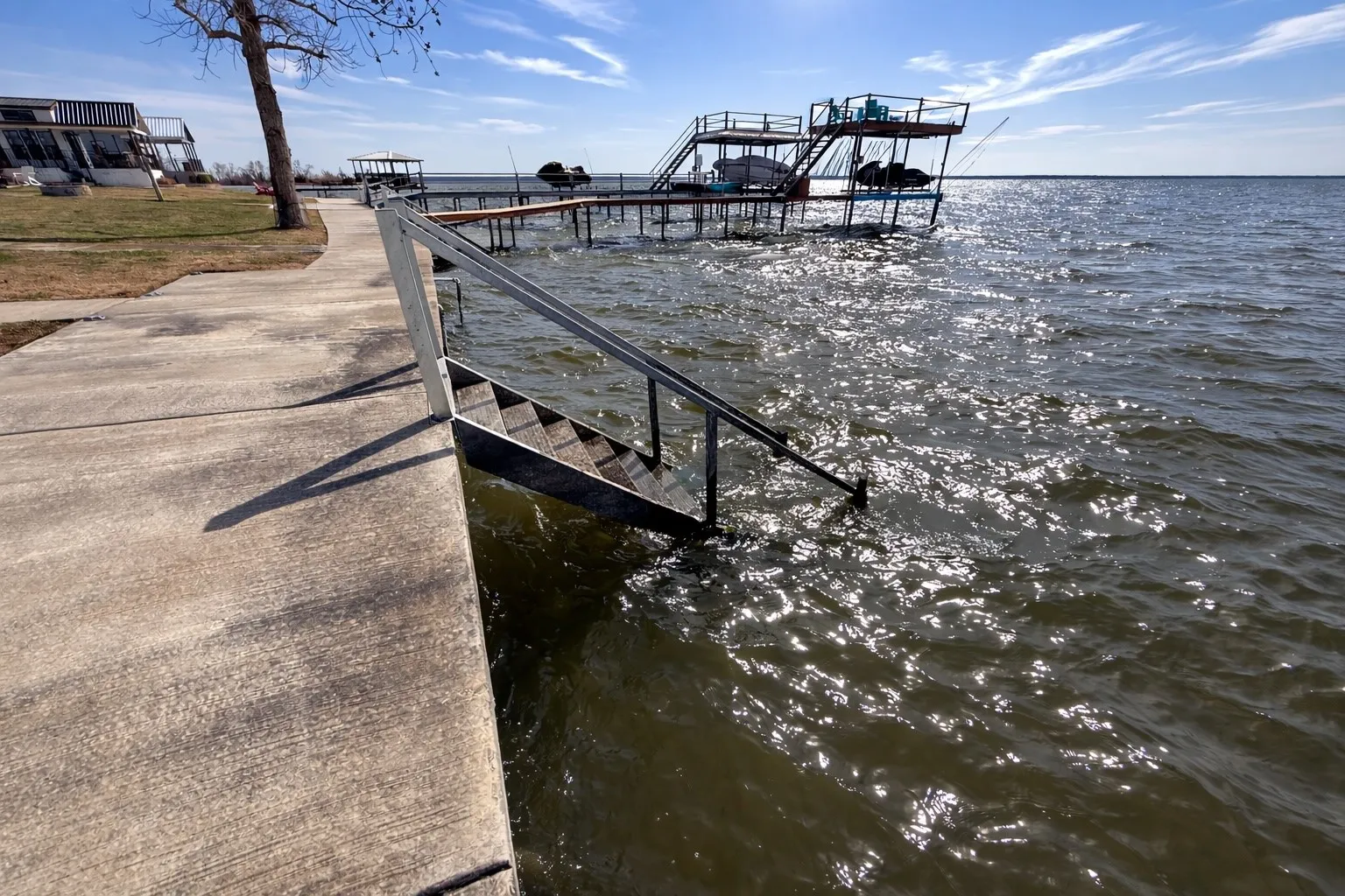 Steel retaining wall and water stairs add value to this lakefront lot.