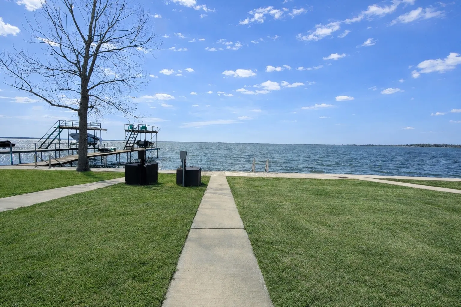 Lakefront lot with sidewalk access in the Peninsula Point community.