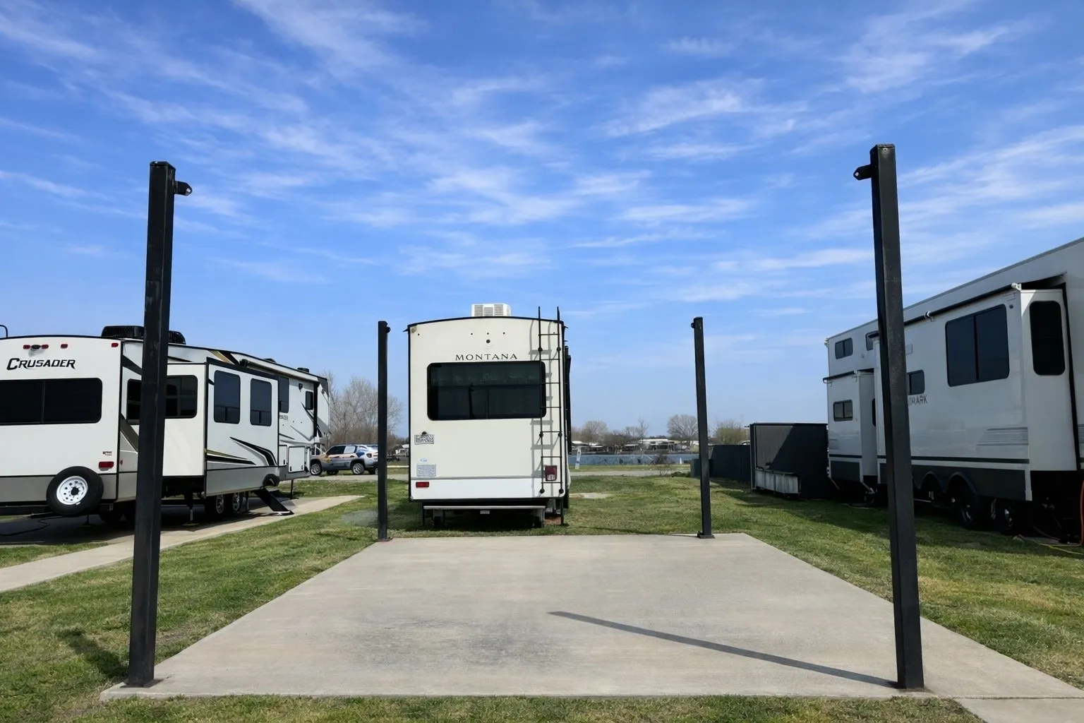 Waterfront concrete pad with shade structure near Corsicana, Texas.