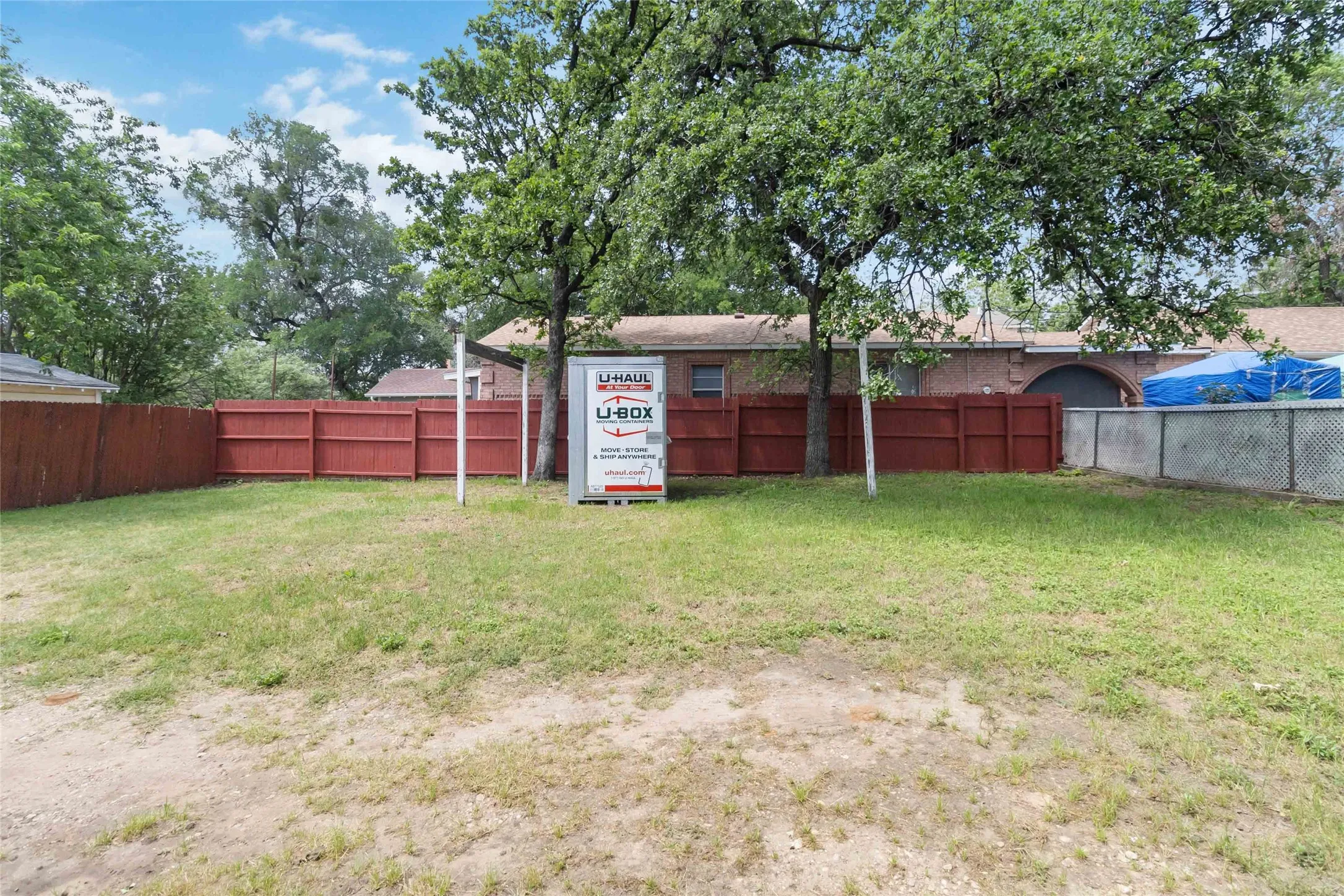 View of fenced backyard
