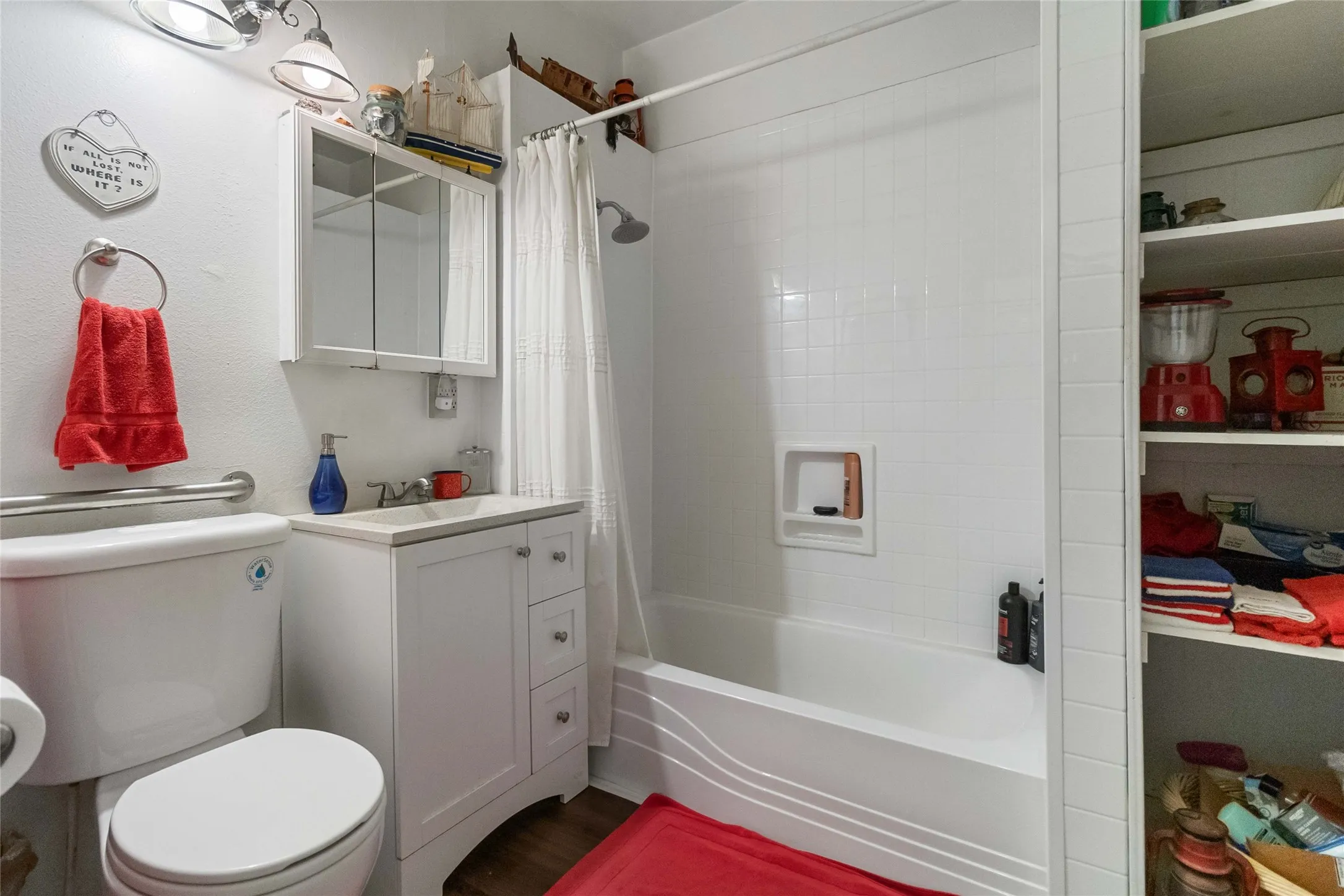 Bathroom with shower / bath combo and vanity