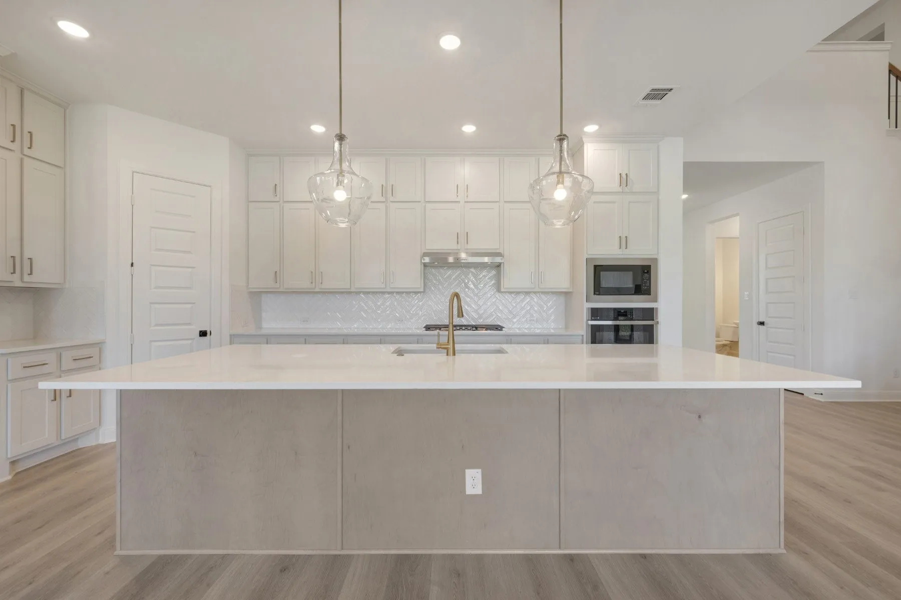 Spacious kitchen island with a light-toned countertop
