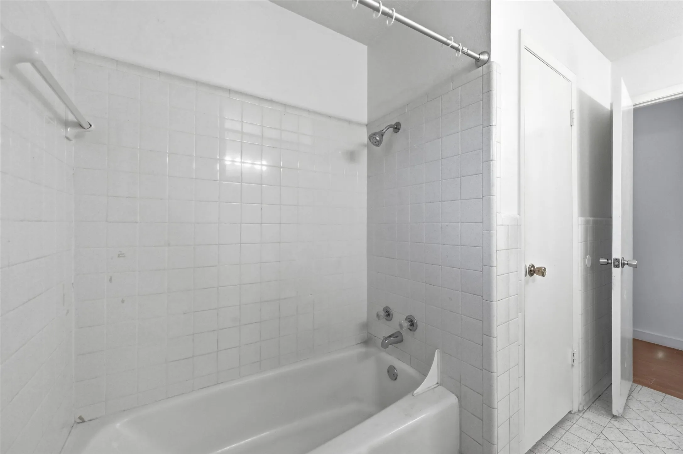 Bathroom with shower / bath combination and tile patterned floors
