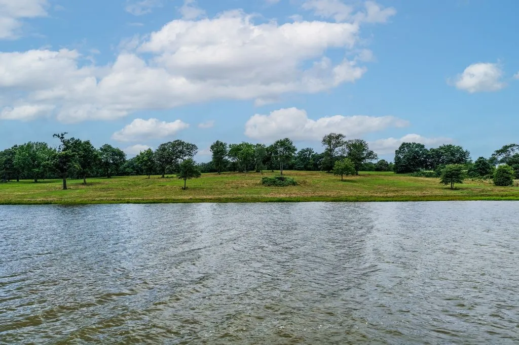 Expansive water frontage with a natural landscape