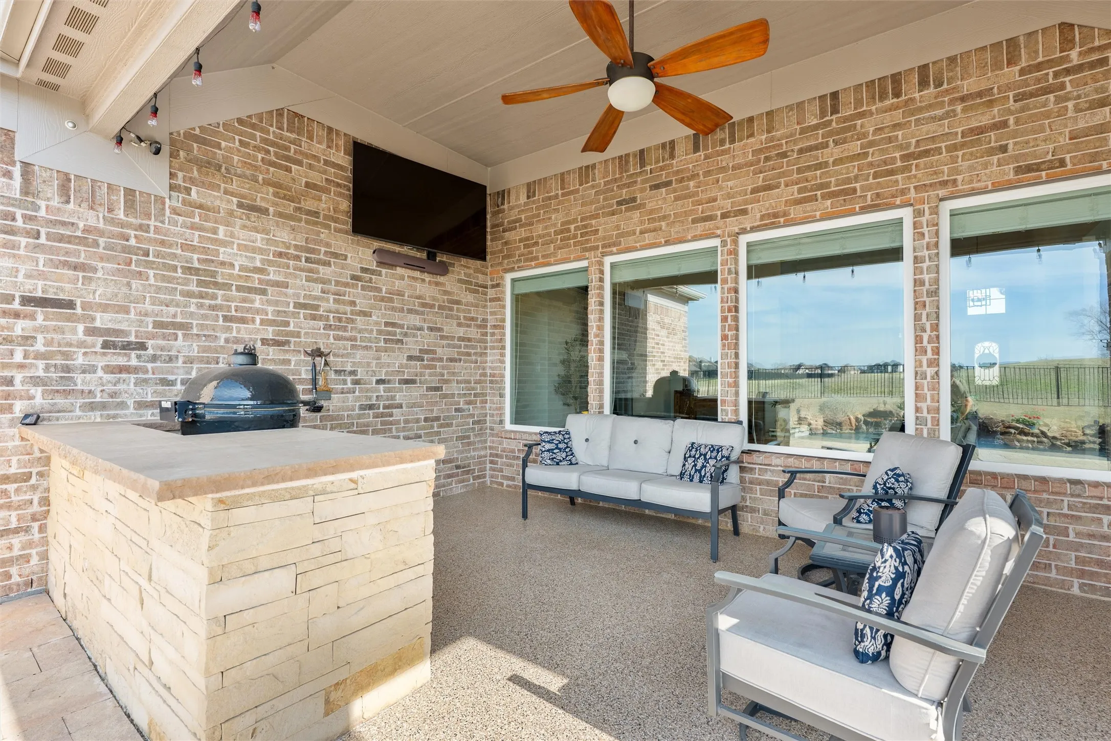 Covered outdoor living and kitchen space.
