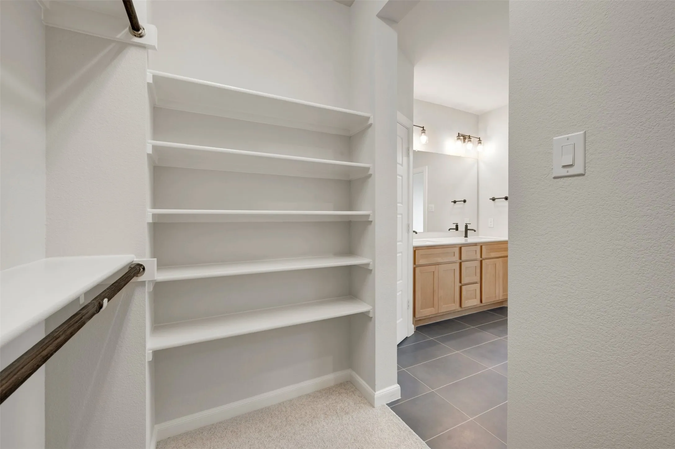 Built-in shelving and hanging rods in the closet