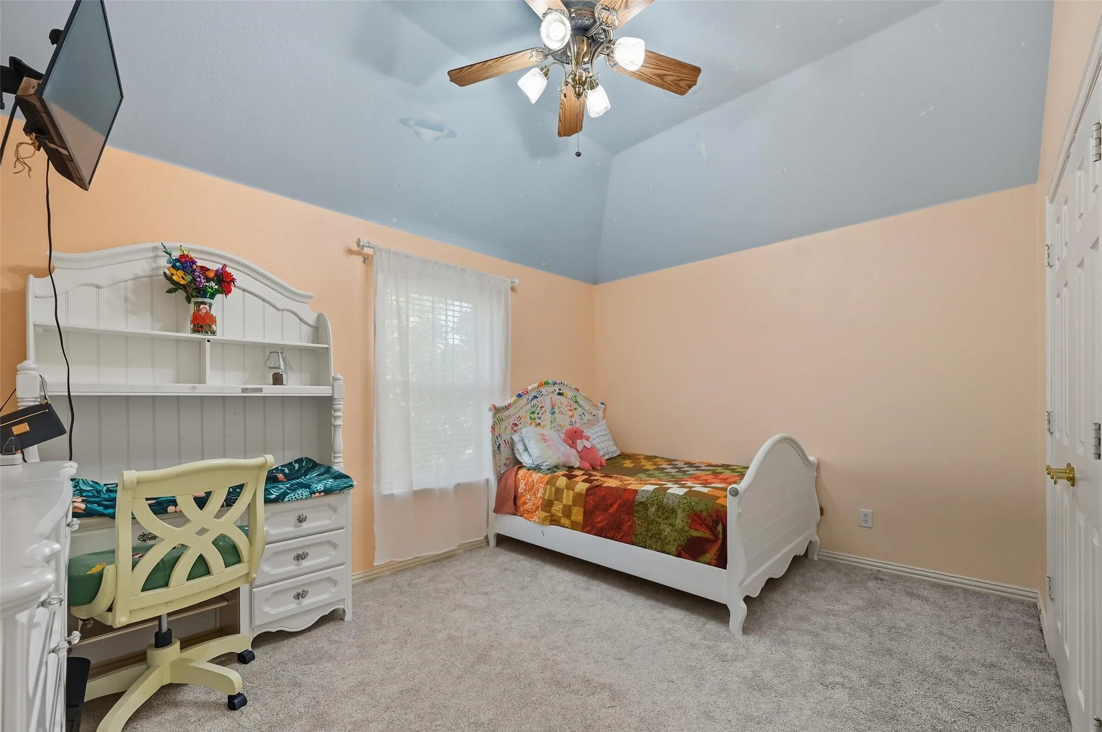 Private upstairs bedroom featuring a raised ceiling and a quiet location at the end of the hall, offering added comfort and privacy.
