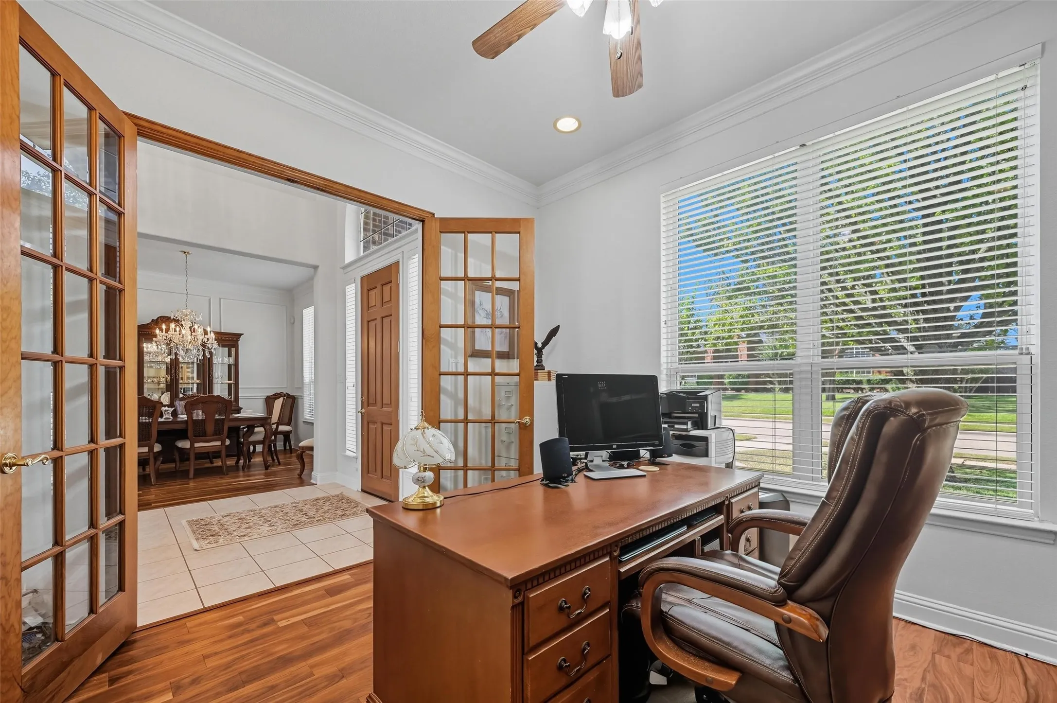 Private home office with elegant French doors, offering the perfect space for working, studying, or managing daily tasks.