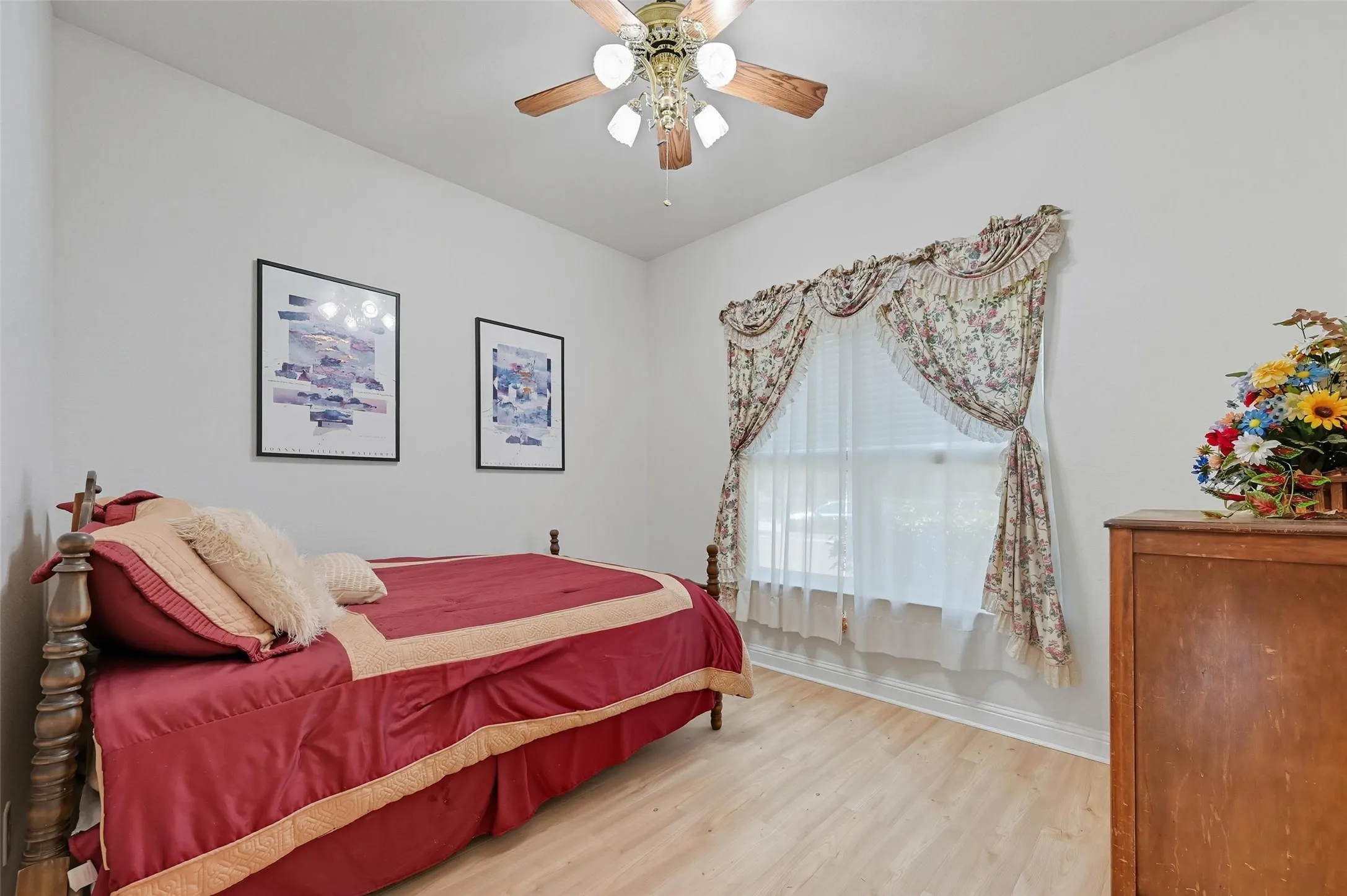 Privately situated downstairs guest suite, separated from the other bedrooms, featuring a large walk-in closet and its own ensuite bath—ideal for guests or multigenerational living.