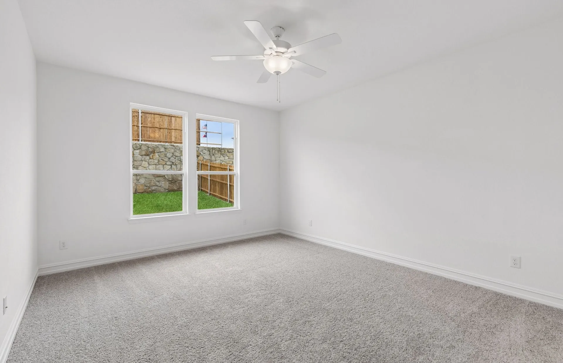 Spacious primary suite with large windows