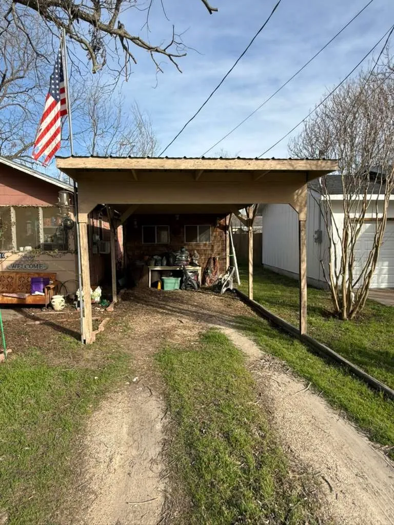 View of shed featuring driveway