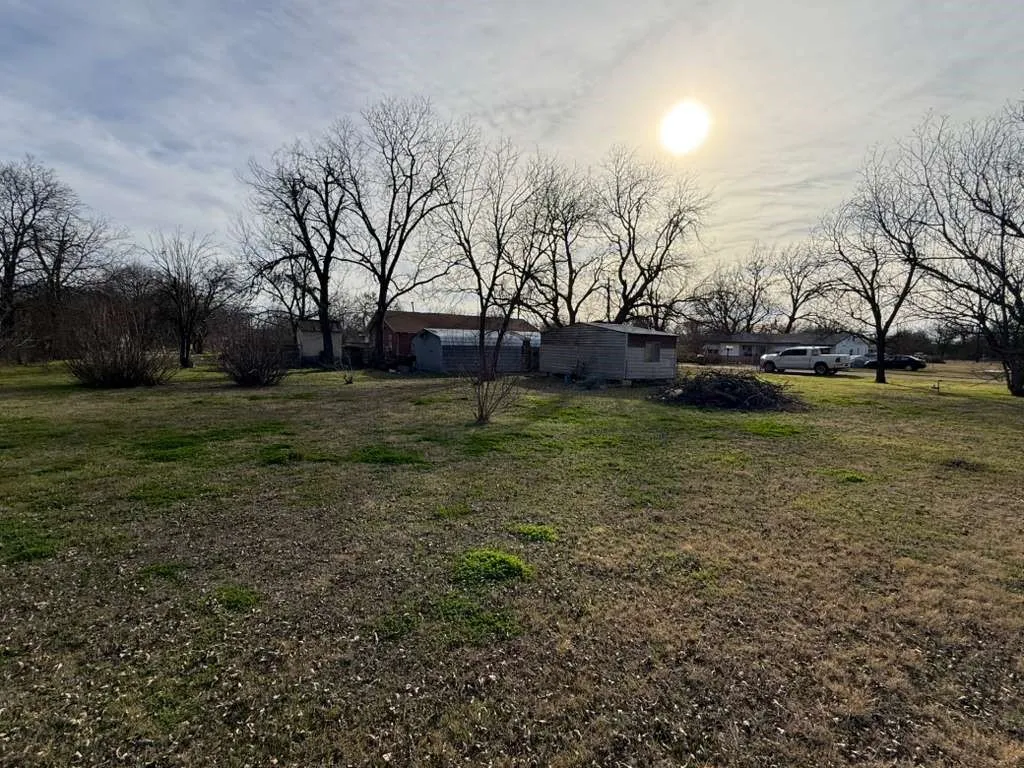 View of green lawn featuring a residential view