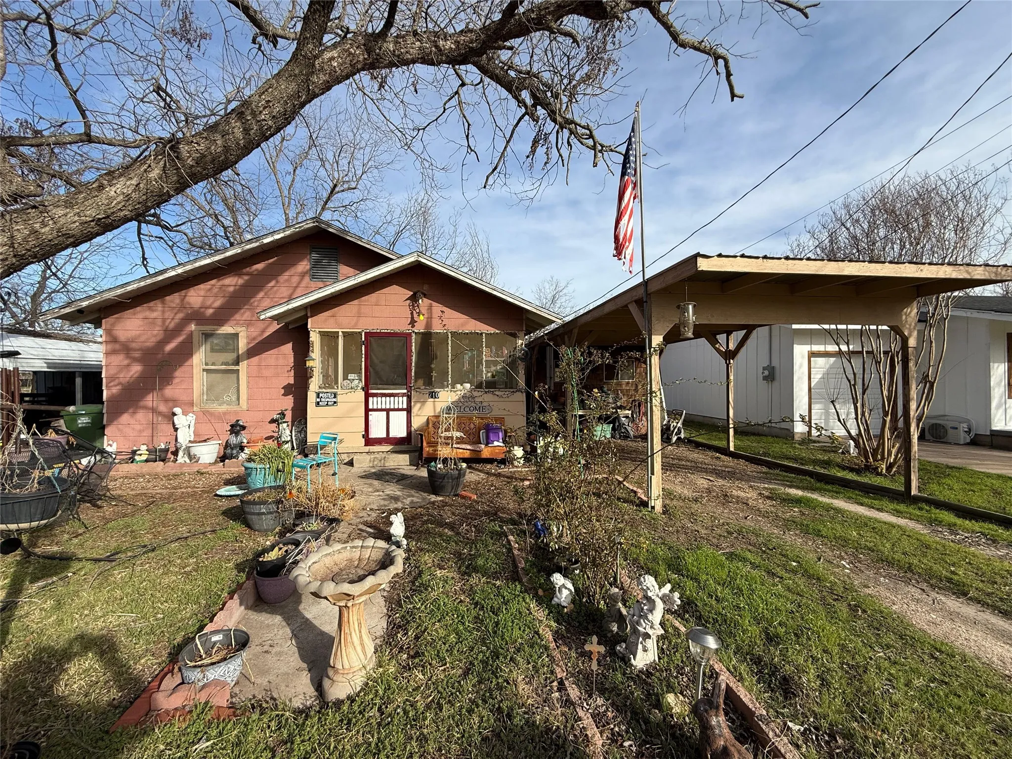 Rear view of house featuring a yard
