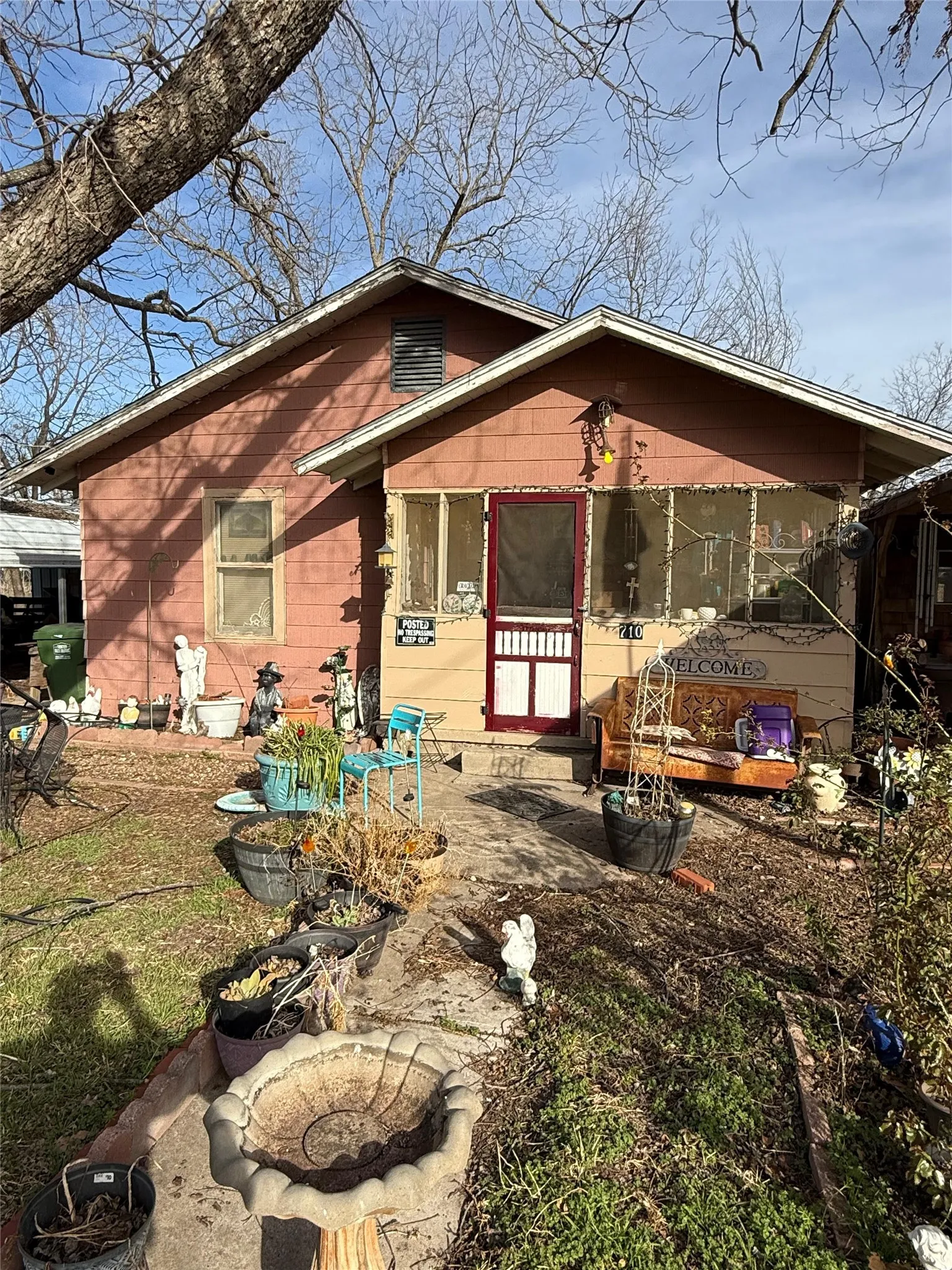 View of front facade with a sunroom