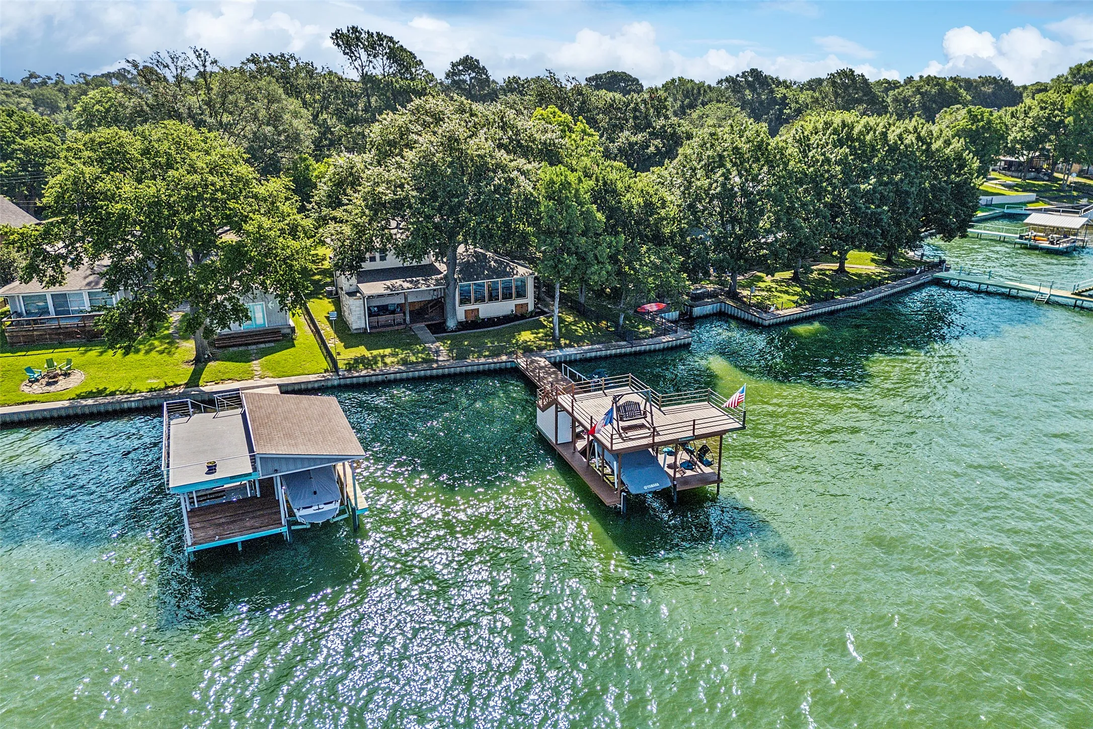 Recently updated deck with space for a boat, 2 jet skis, roof top and storage.