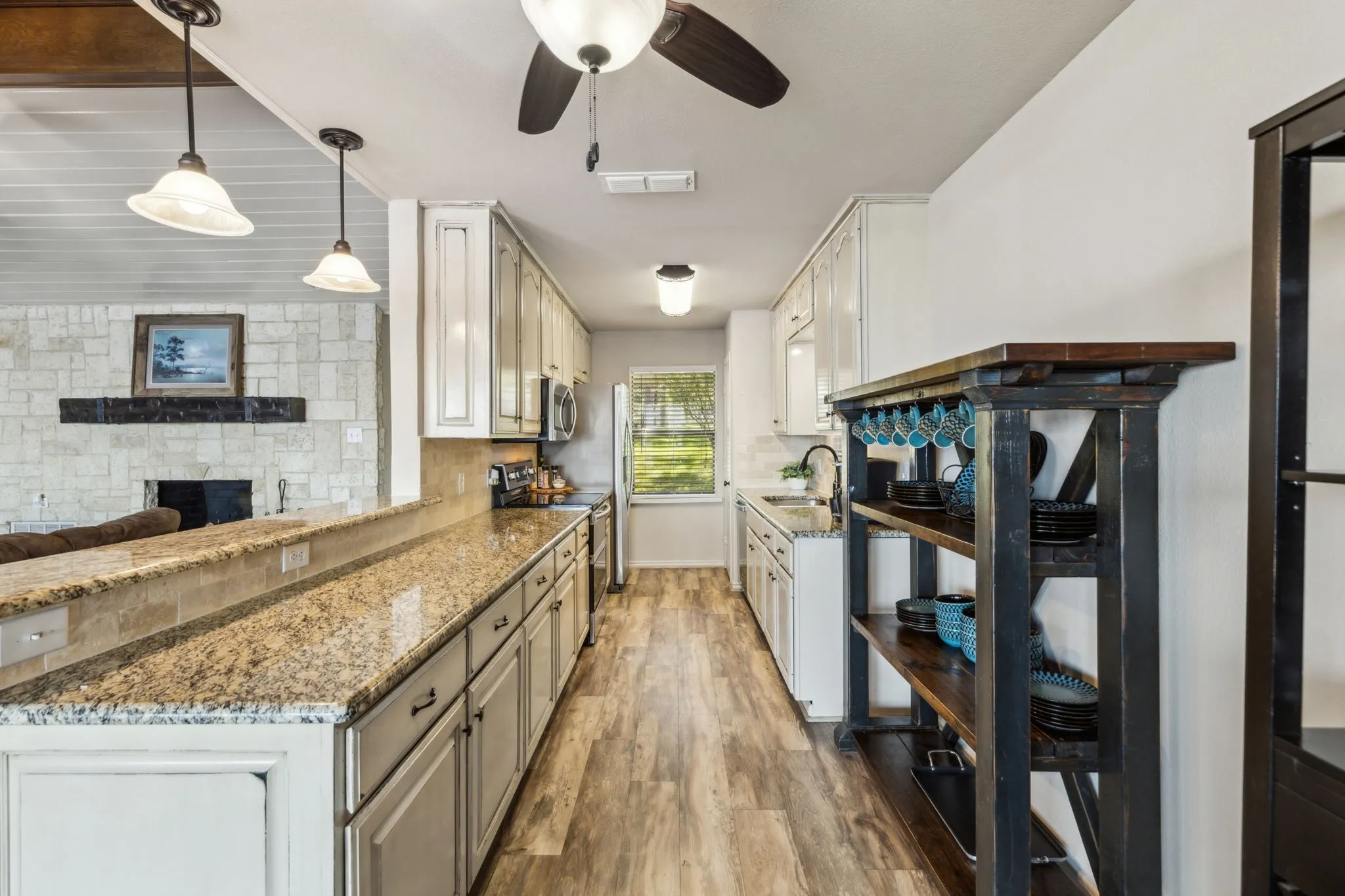 Light and bright neutral kitchen open to the living area.