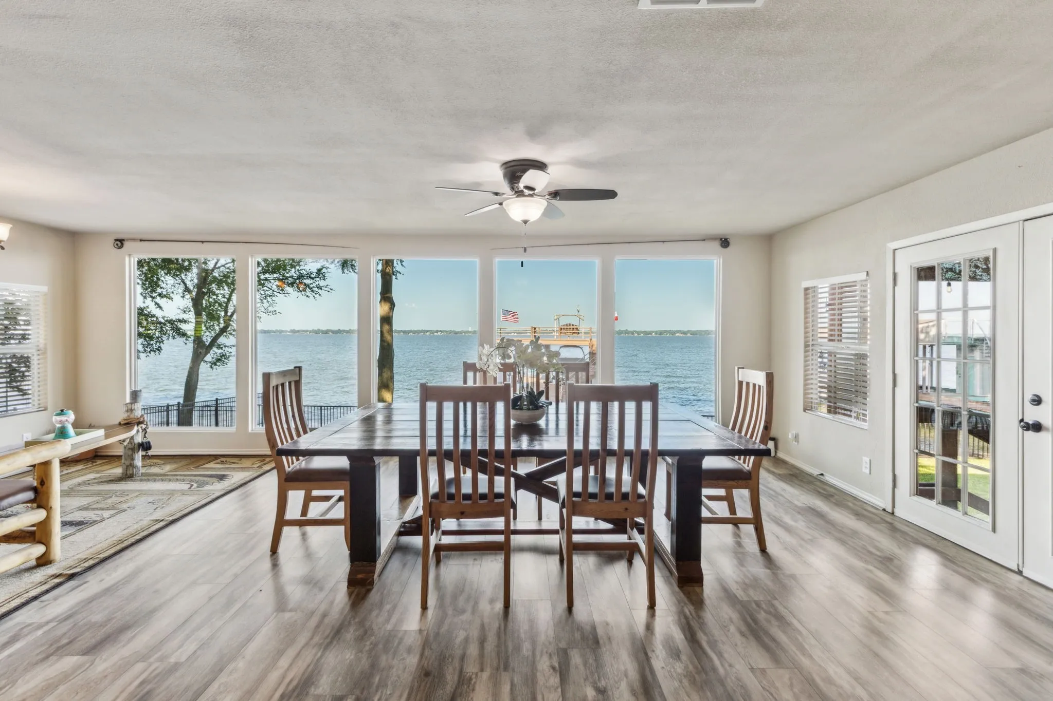 Picturesque views from the great room with floor to ceiling windows overlooking the lake view.